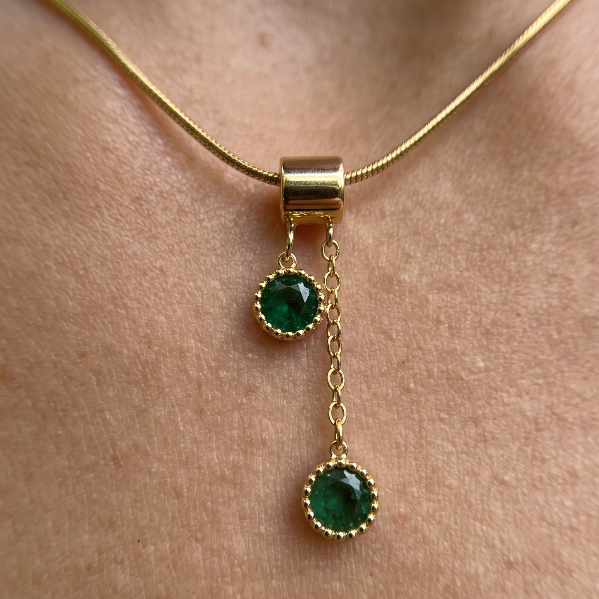 1.50 CTW green round gemstone drop necklace in polished yellow gold.