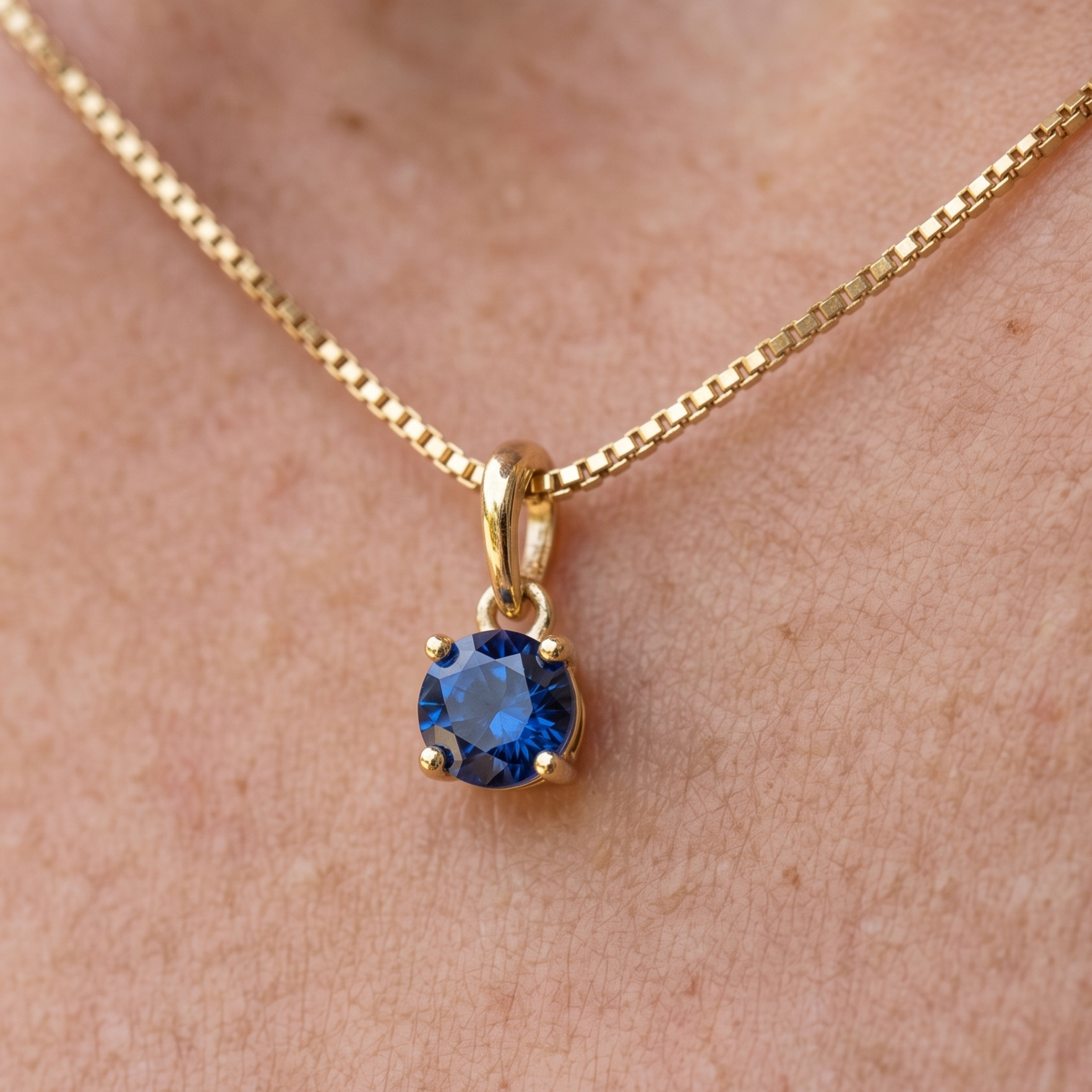 Celestial Blue 0.84 CT round solitaire pendant by Kiashaa Jewellery featuring a 6 mm blue center stone in yellow gold.