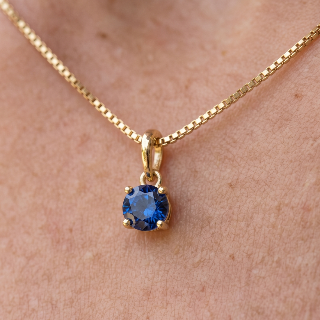 Celestial Blue 0.84 CT round solitaire pendant by Kiashaa Jewellery featuring a 6 mm blue center stone in yellow gold.