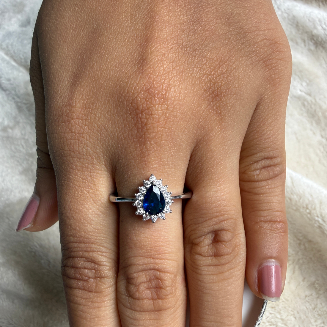 Blue pear gemstone and lab-grown diamond halo ring by Kiashaa Jewellery.