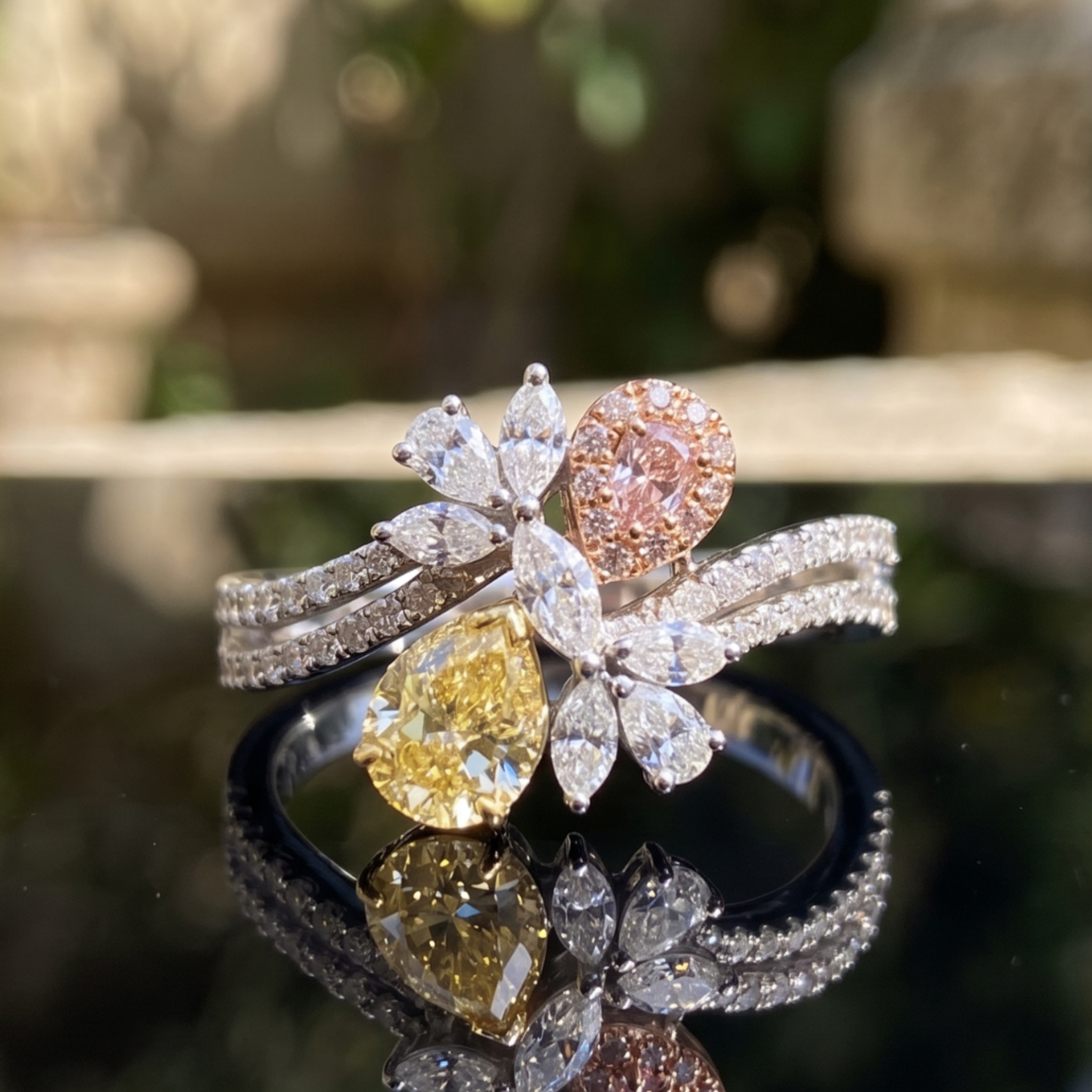 Aurora Bloom 3 CTW multi-color diamond floral ring by Kiashaa Jewellery with yellow and pink pear-shaped diamonds.