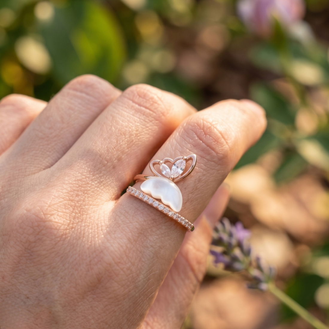 Nature-inspired open ring featuring marquise diamonds and a sculpted white pearl.