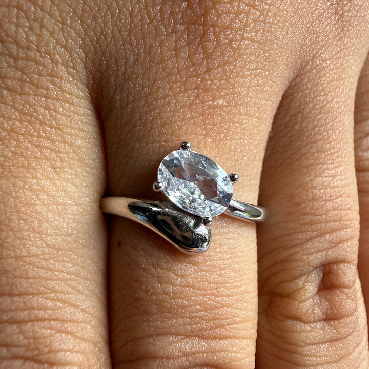 Oval lab-grown diamond bypass solitaire ring in white gold by Kiashaa Jewellery.