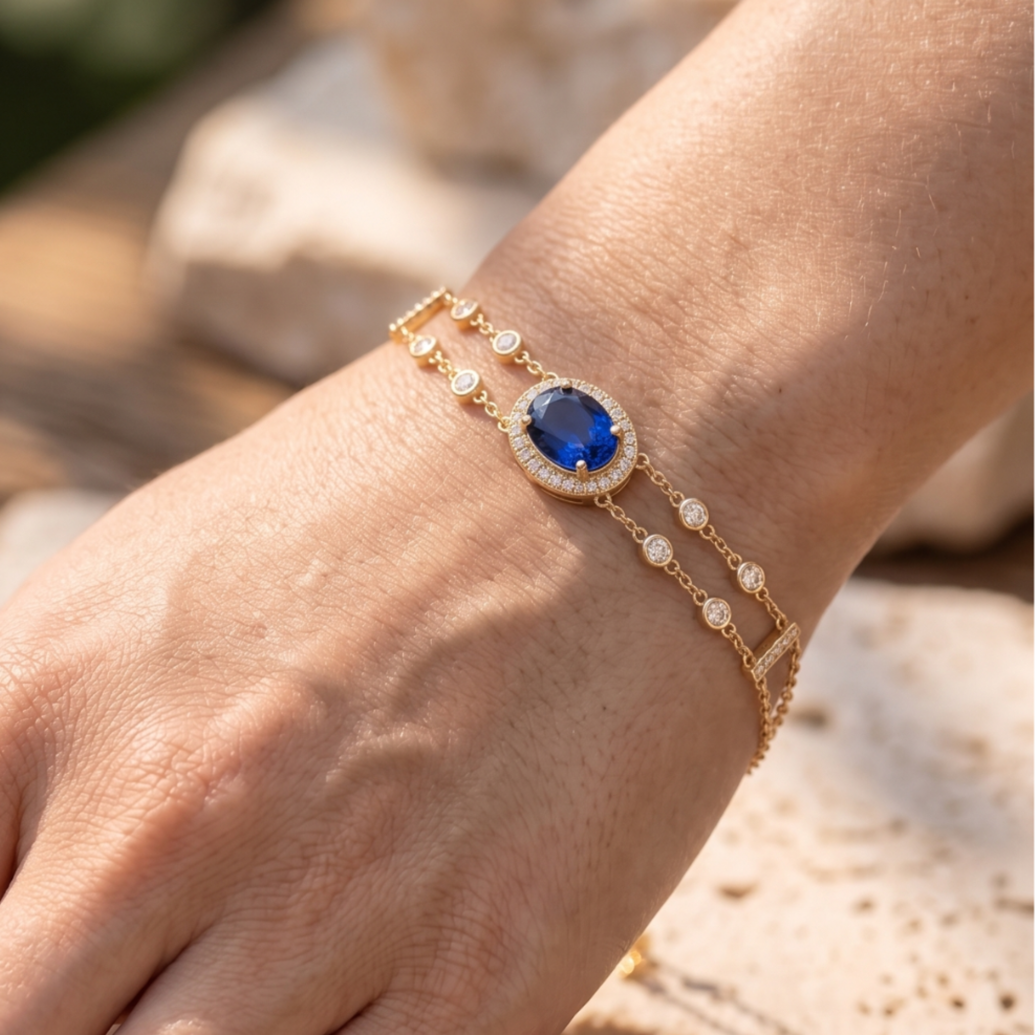 2 CT oval blue sapphire bracelet with diamond halo in yellow gold by Kiashaa Jewellery.