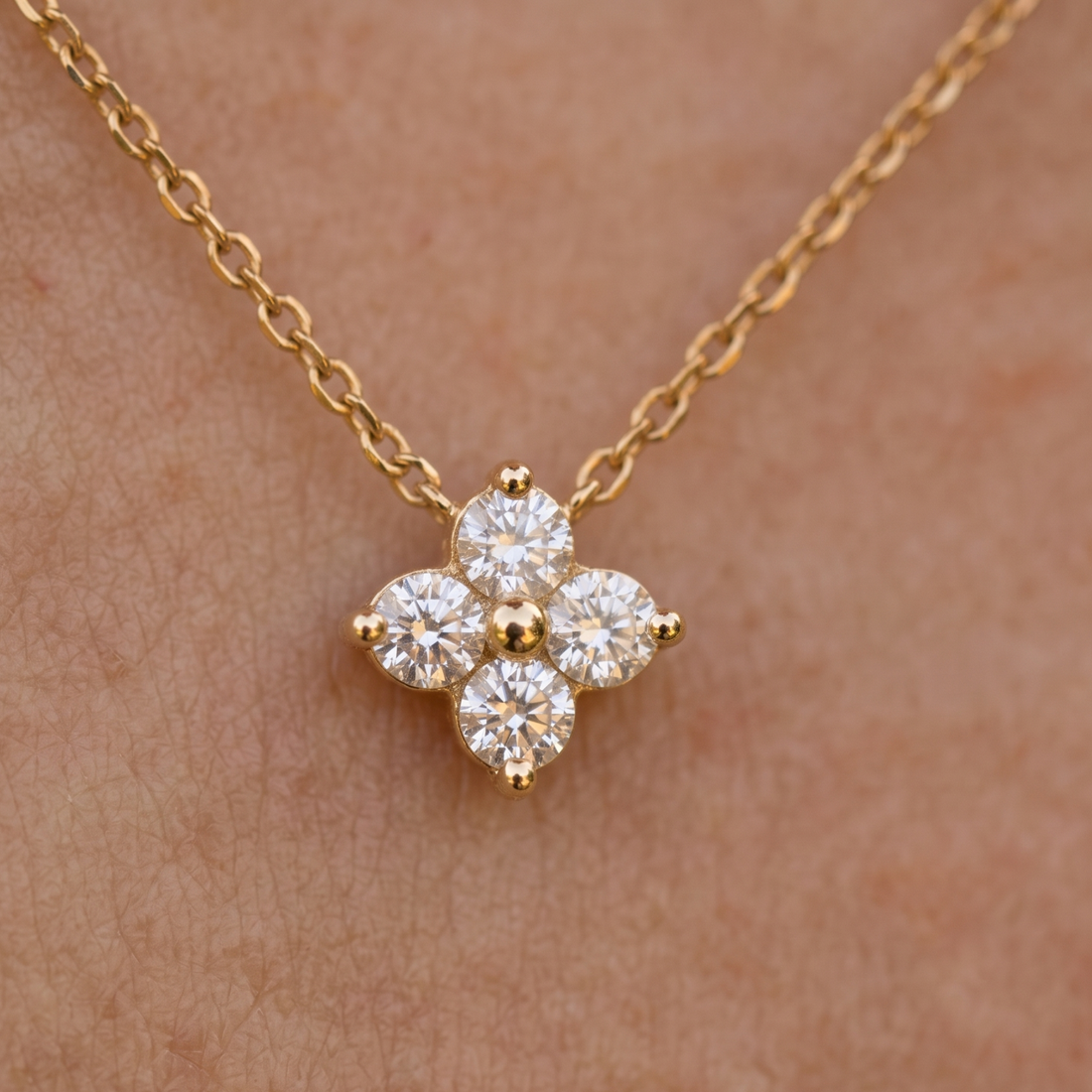 Kiashaa Jewellery 0.14 CTW round diamond flower necklace in polished yellow gold.