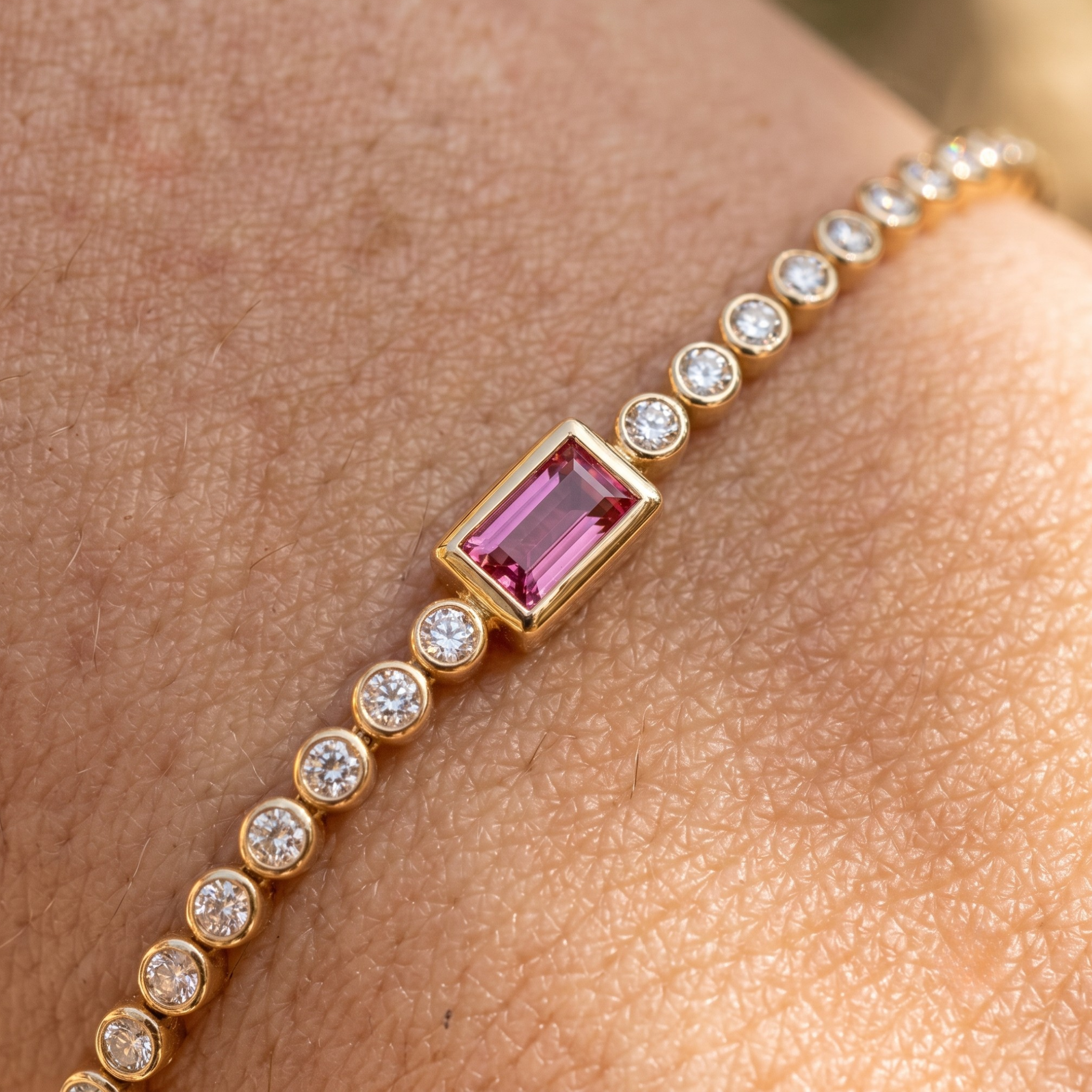 Kiashaa Jewellery 1.75 CTW diamond tennis bracelet with pink baguette center stone in yellow gold.