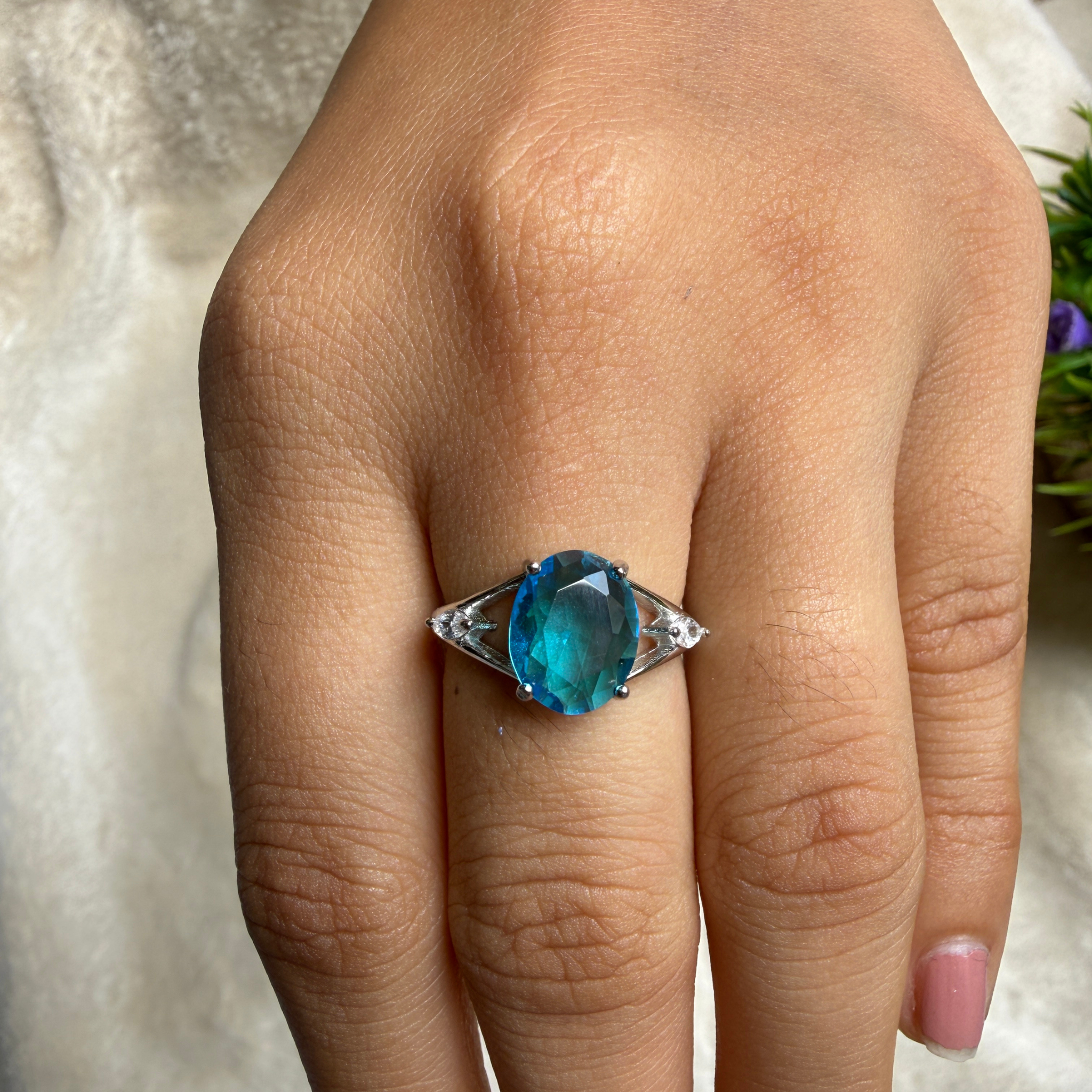 Blue oval gemstone solitaire ring with marquise lab-grown diamonds by Kiashaa Jewellery.