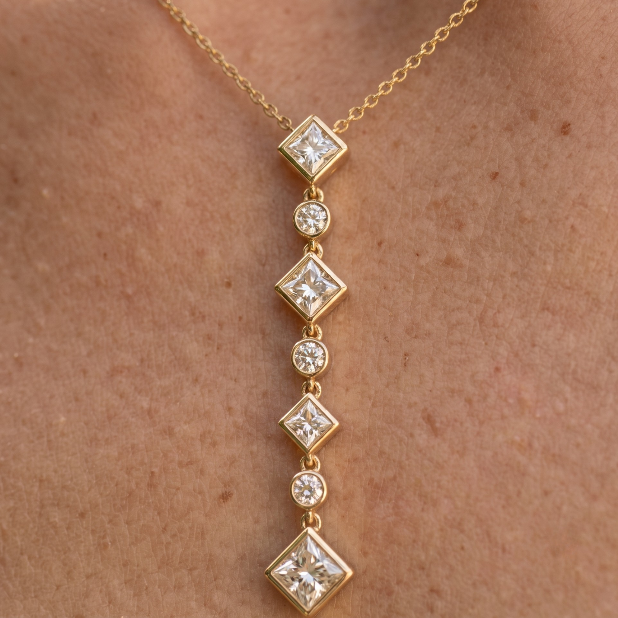 Kiashaa Jewellery 5.32 CTW princess and round diamond drop necklace in polished yellow gold.
