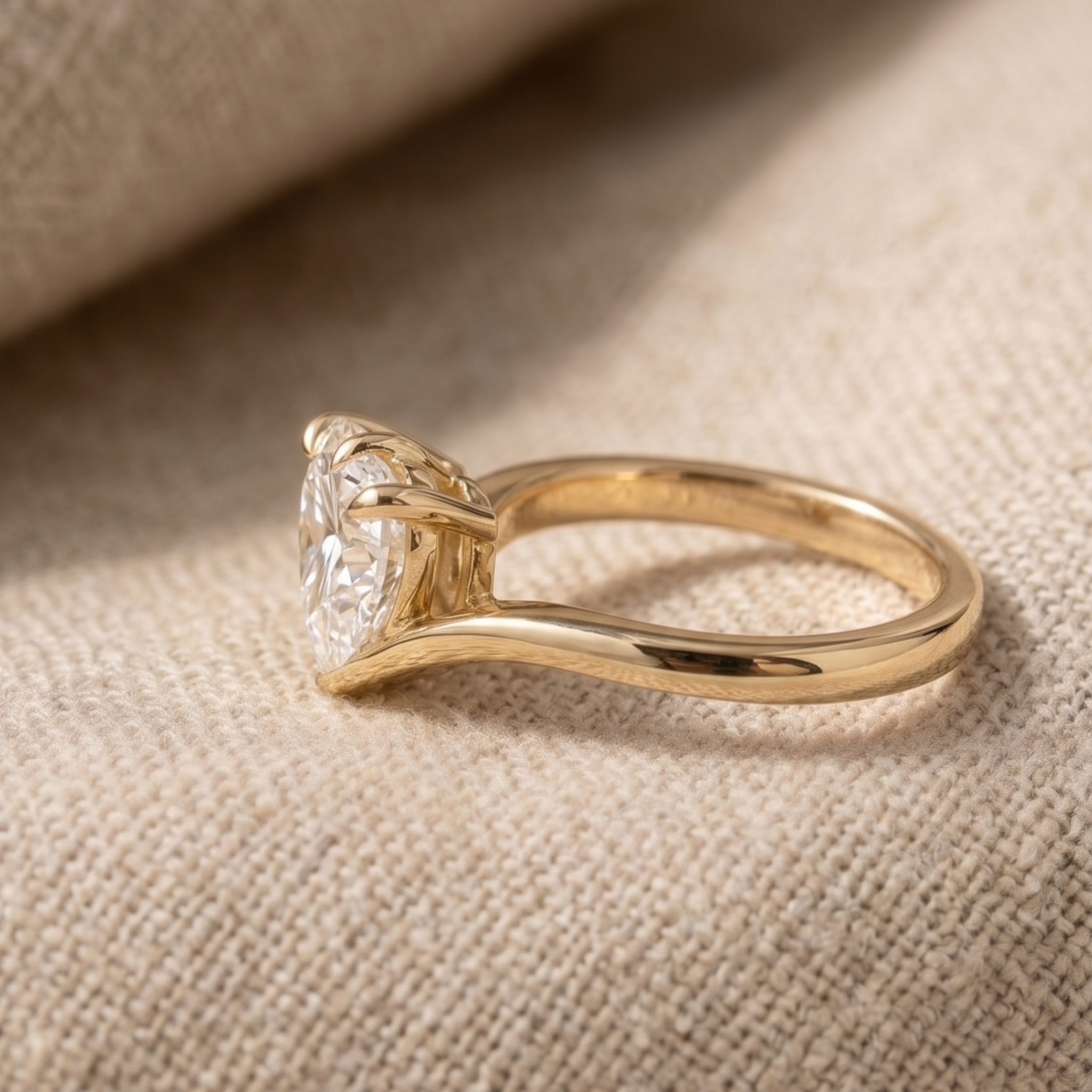 Yellow gold heart diamond solitaire ring with V-shaped band