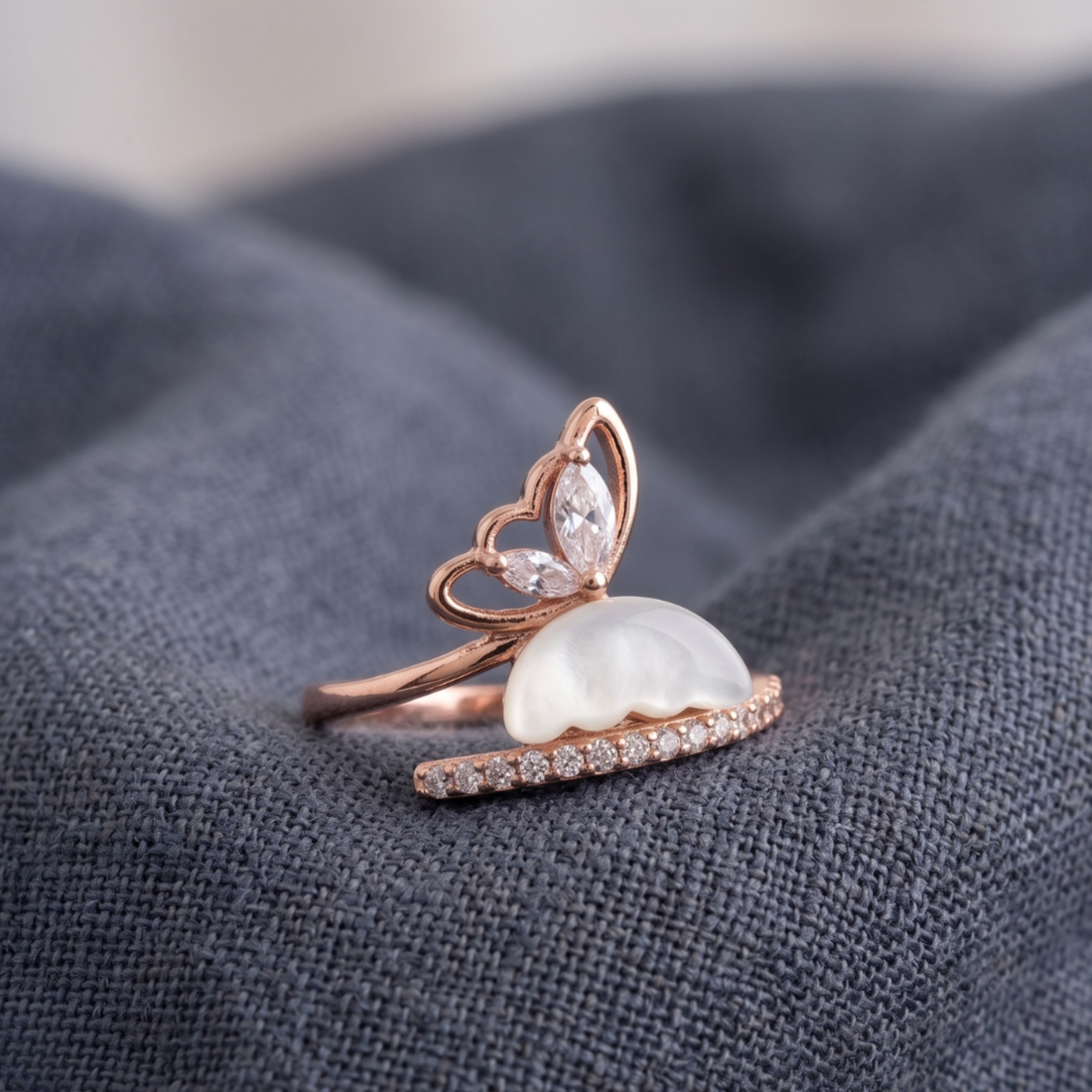 Nature-inspired open ring featuring marquise diamonds and a sculpted white pearl.