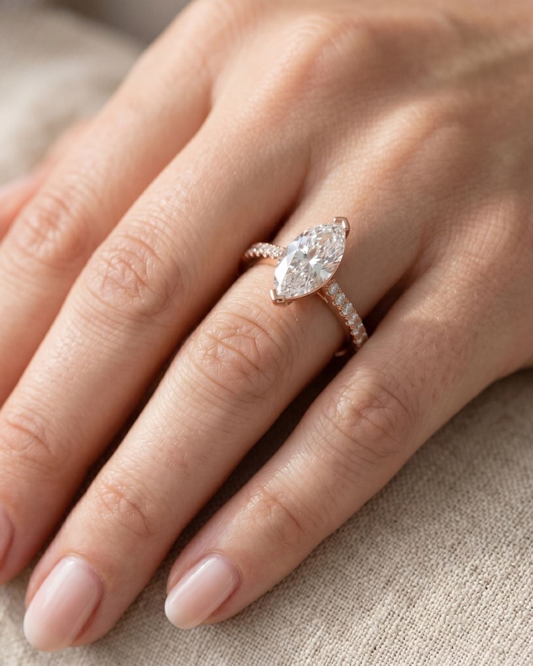 Elegant marquise lab-grown diamond ring with round accent band
