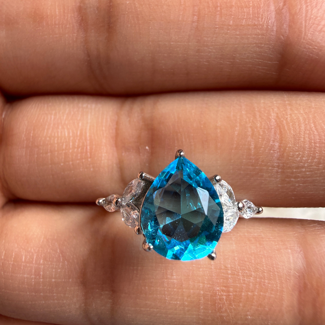 Blue pear gemstone and marquise lab-grown diamond ring by Kiashaa Jewellery.