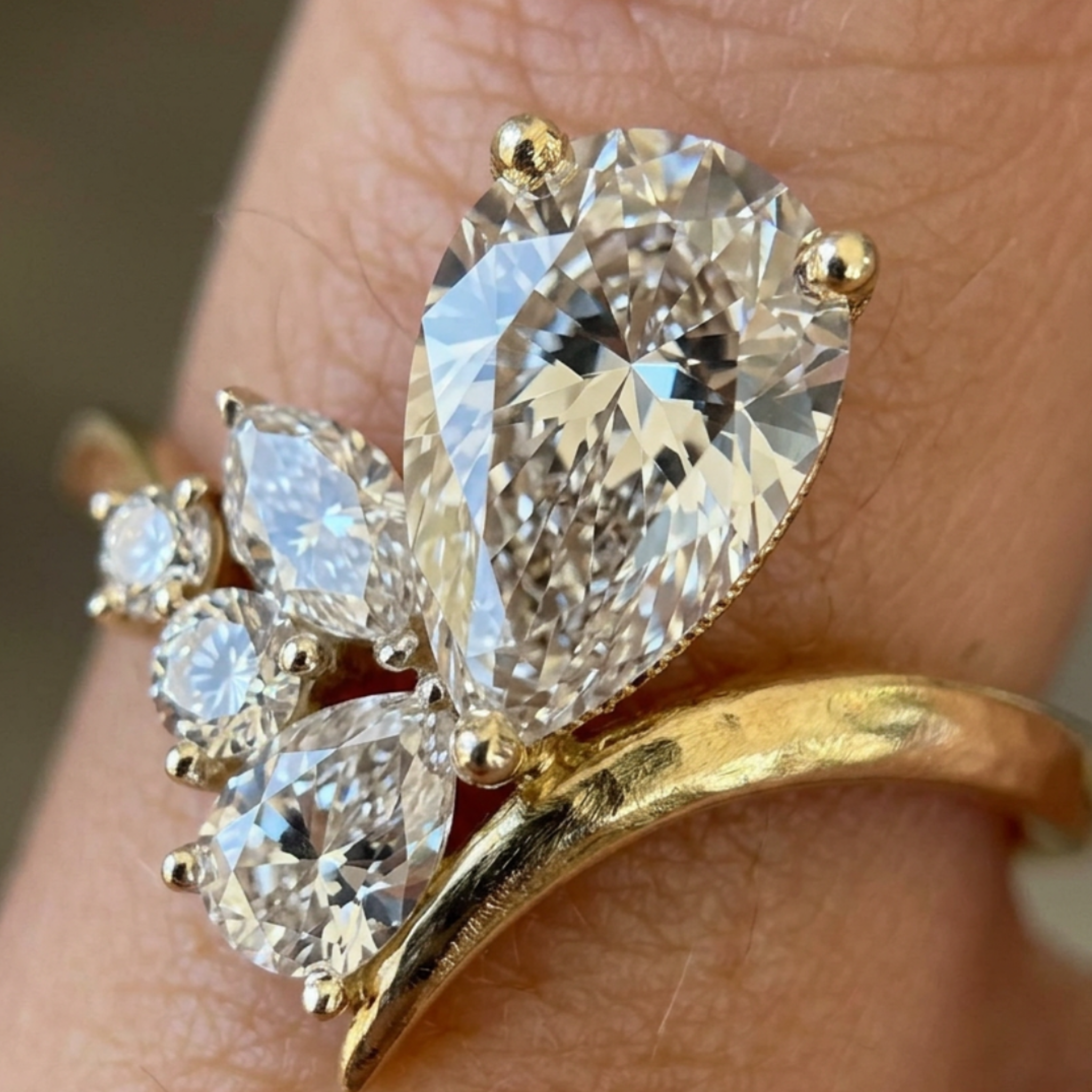 Flora Embrace 3 CTW lab-grown diamond ring by Kiashaa Jewellery with a 2 CT pear center and multi-shape side diamonds.