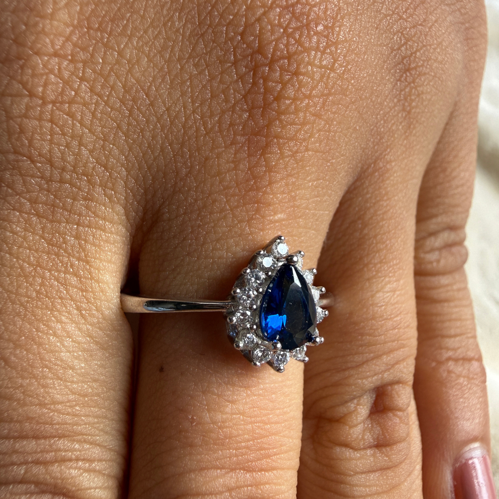 Blue pear gemstone and lab-grown diamond halo ring by Kiashaa Jewellery.
