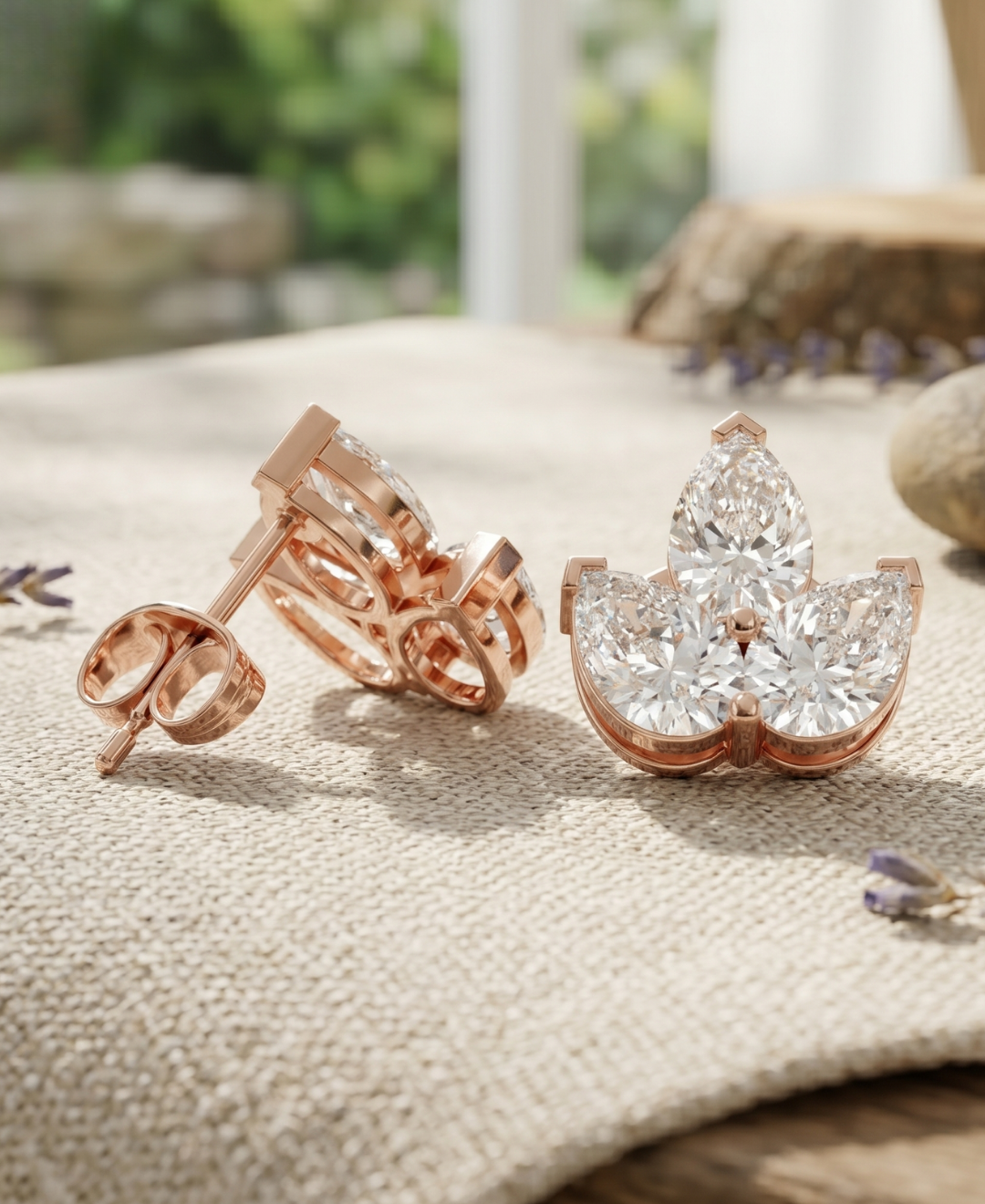 Lab-grown diamond stud earrings with pear cut stones and secure push back closure.