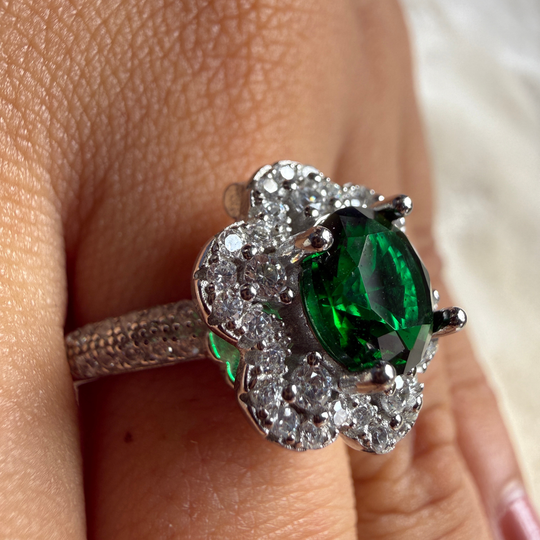 Green gemstone floral halo ring with lab-grown diamonds by Kiashaa Jewellery.