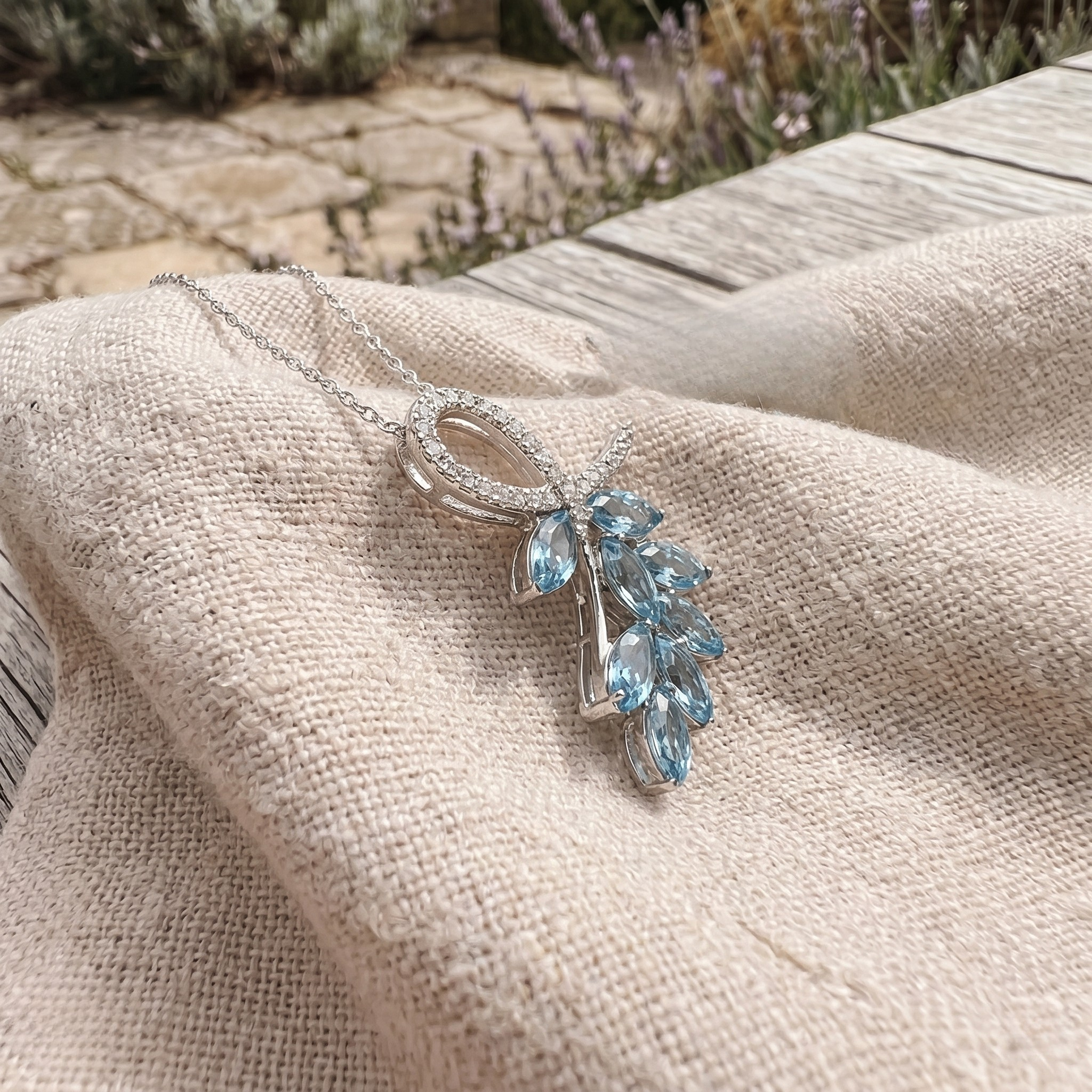 Sky blue marquise gemstone leaf pendant necklace with lab-grown diamonds by Kiashaa Jewellery.