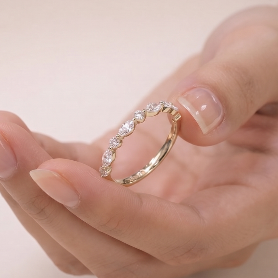 Marquise and round diamond wedding band by Kiashaa Jewellery in polished yellow gold.
