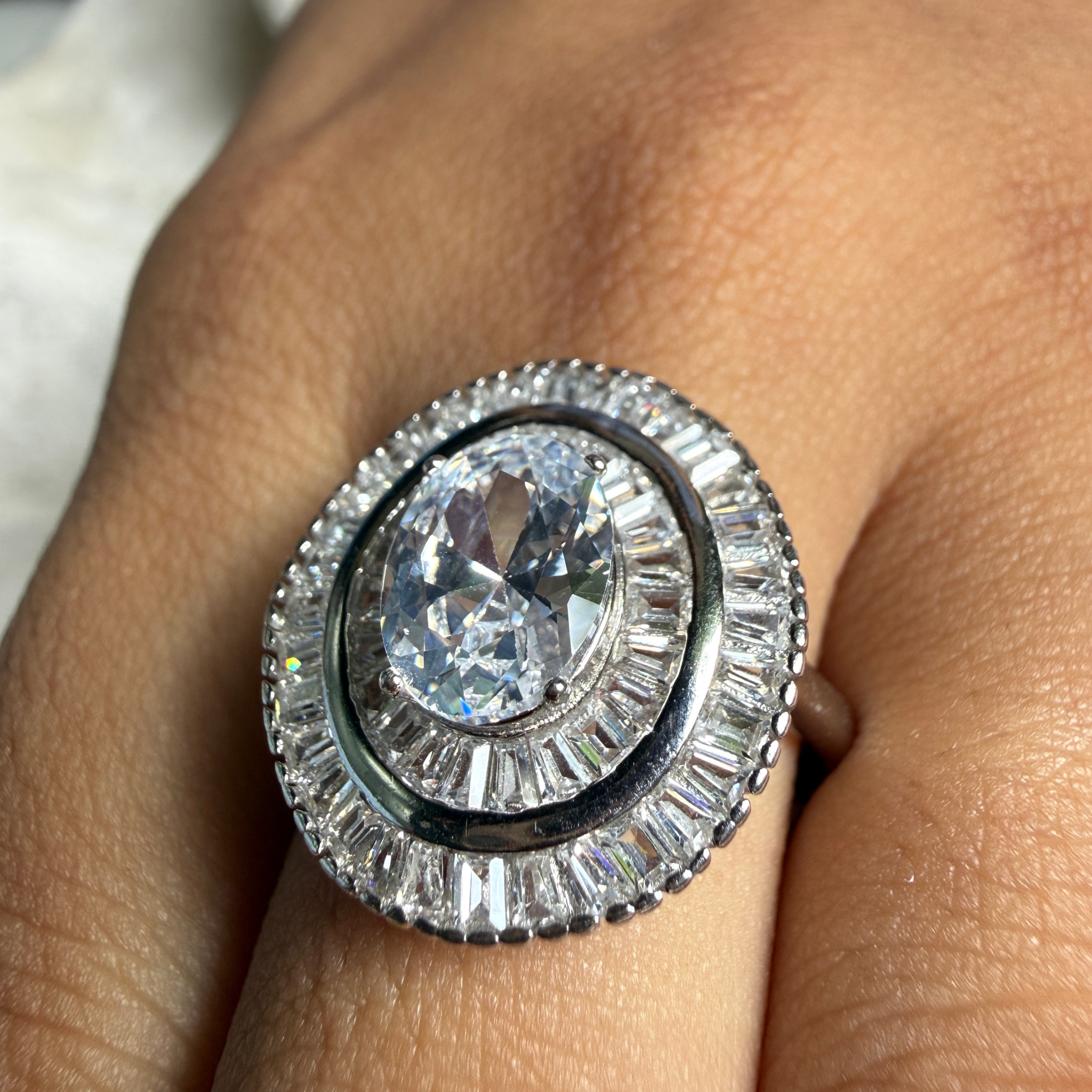 Oval and baguette lab-grown diamond double halo ring by Kiashaa Jewellery.
