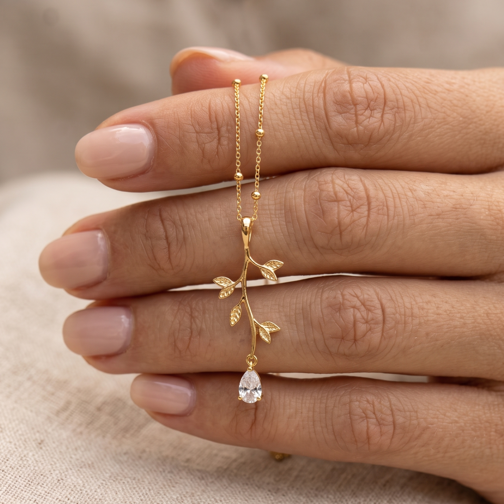 Kiashaa Jewellery 0.39 CT pear diamond leaf pendant necklace in polished yellow gold.