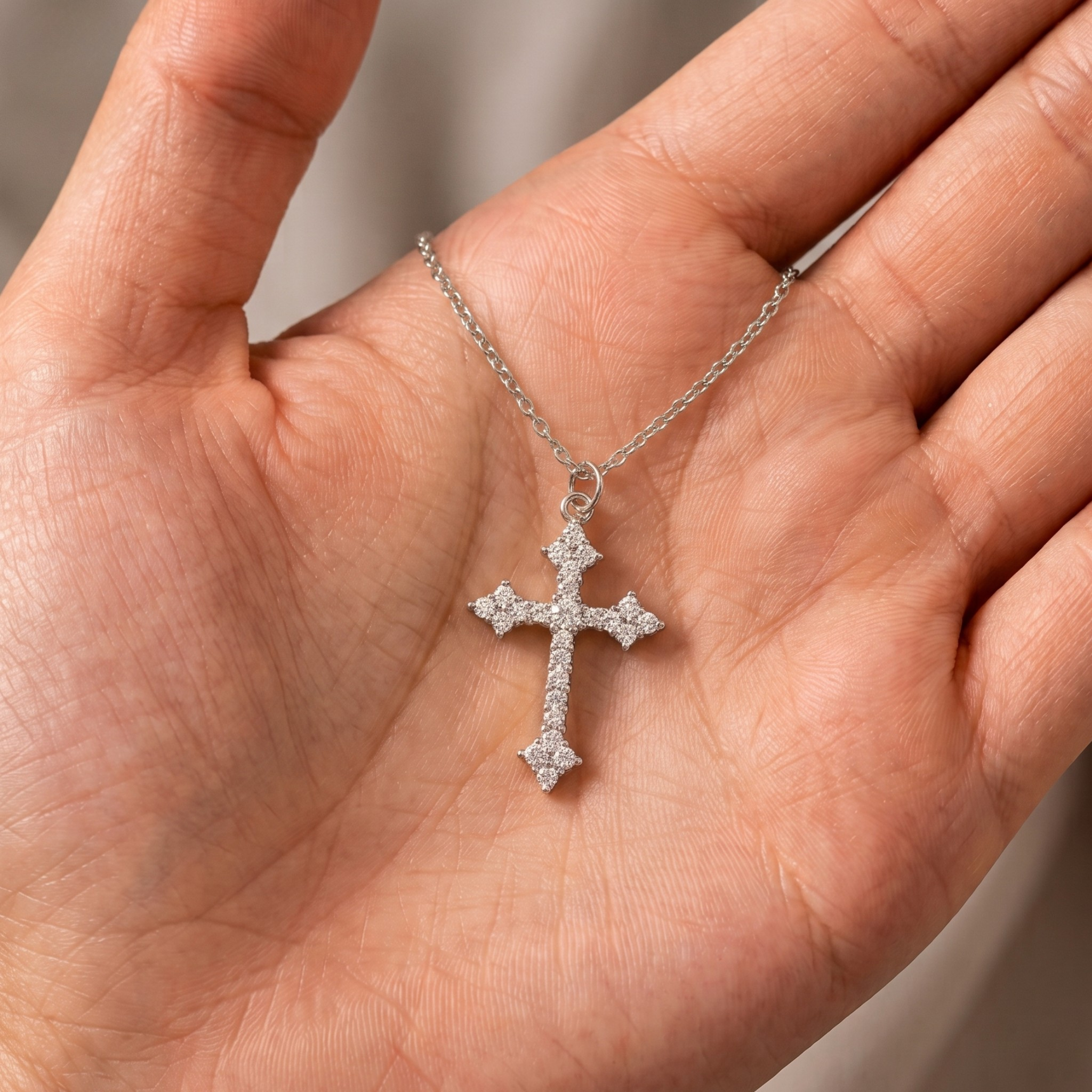 Yellow gold religious cross pendant embellished with brilliant round diamonds.