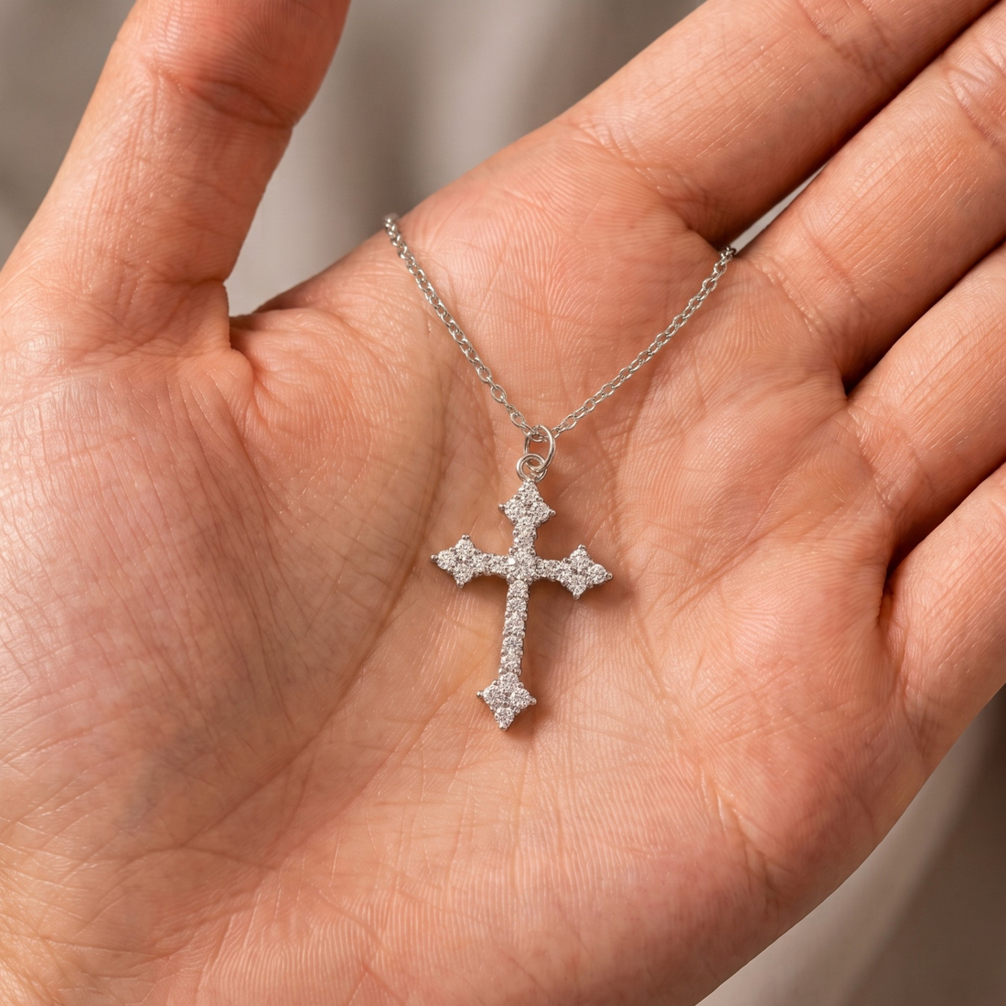 Yellow gold religious cross pendant embellished with brilliant round diamonds.