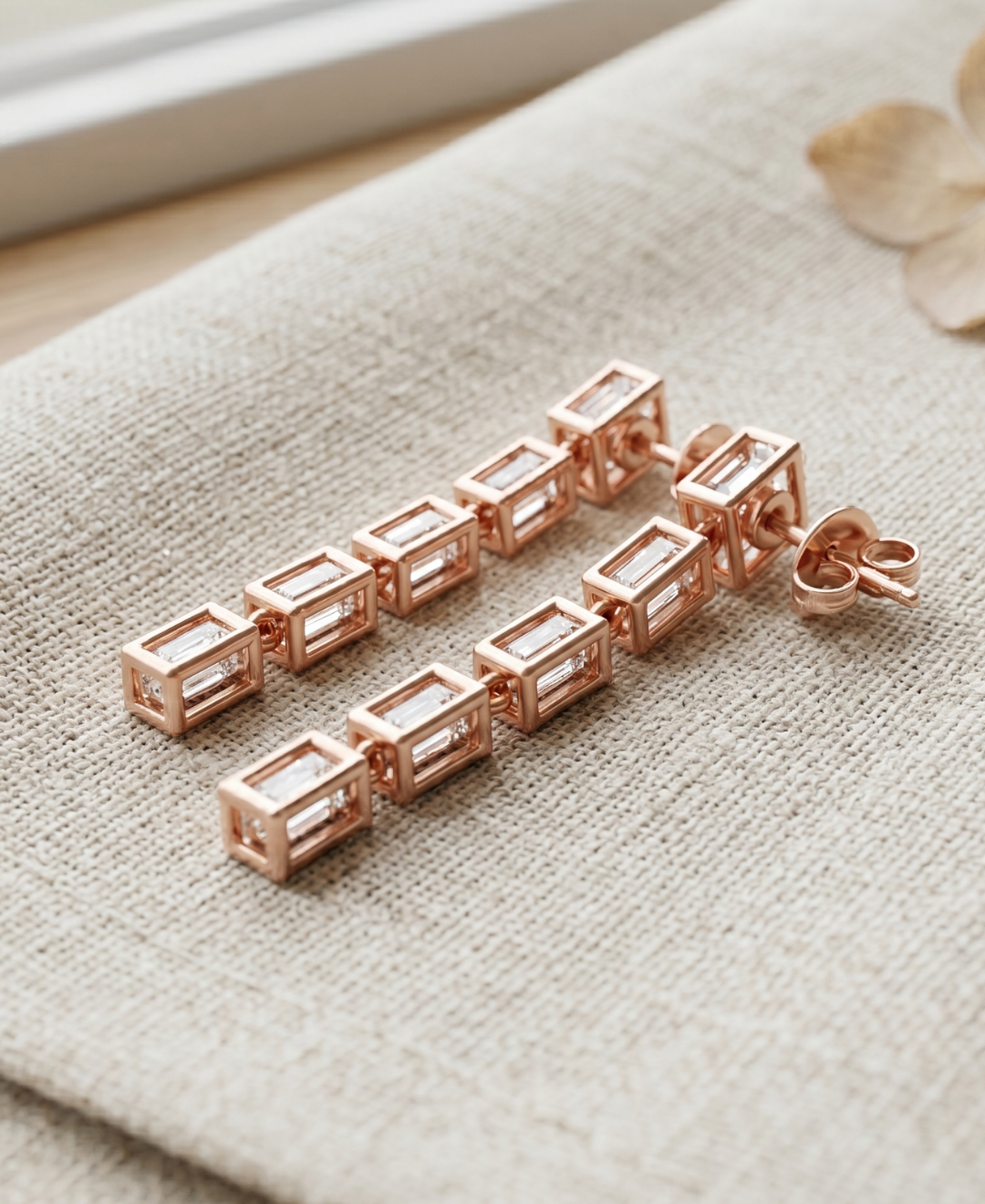 Kiashaa Jewellery emerald lab-grown diamond drop earrings in rose gold with five geometric stones per earring.