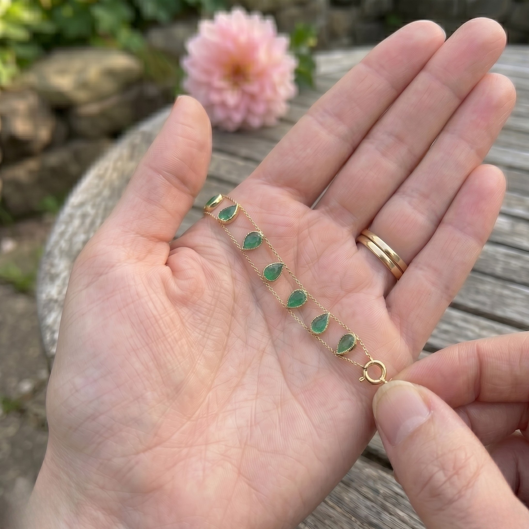 Elegant botanical bracelet with pear and marquise-shaped green crystal stations.