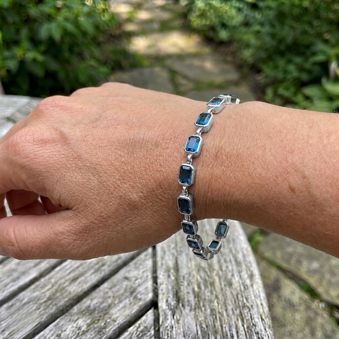 Classic gemstone tennis bracelet available in white, yellow, and rose gold.