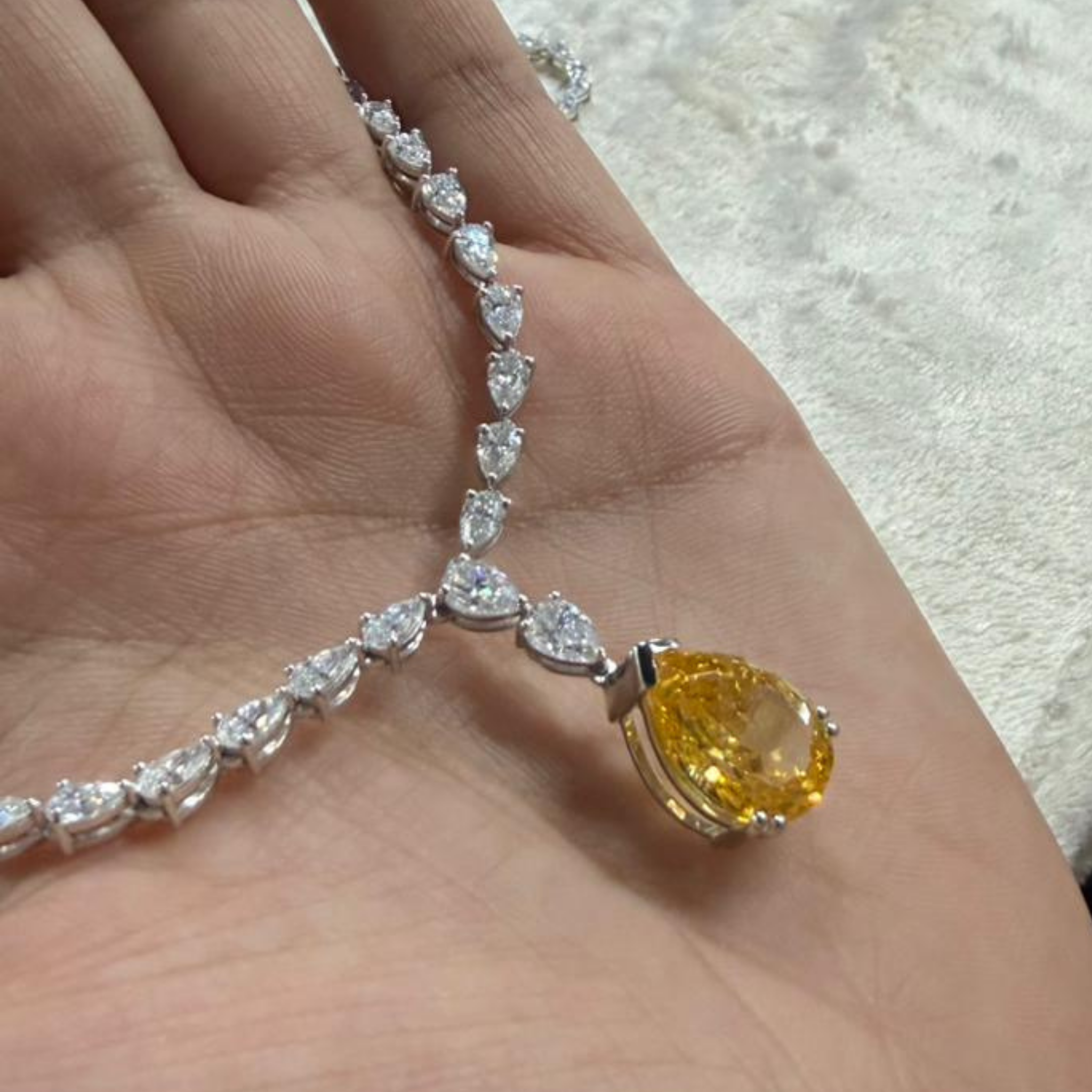 Luxury statement necklace featuring 74 listed pear-shaped stones in a graduated arrangement.