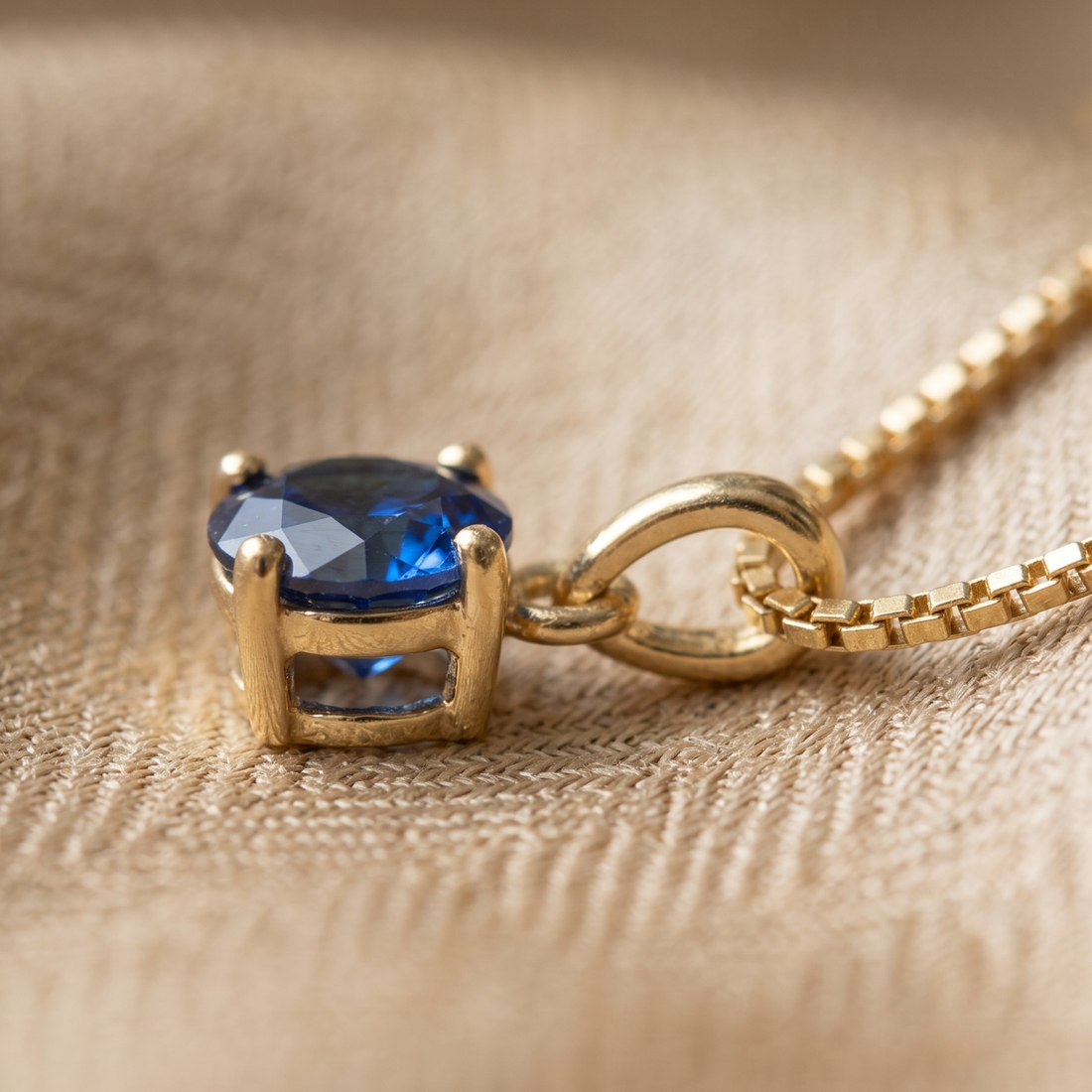 Celestial Blue 0.84 CT round solitaire pendant by Kiashaa Jewellery featuring a 6 mm blue center stone in yellow gold.