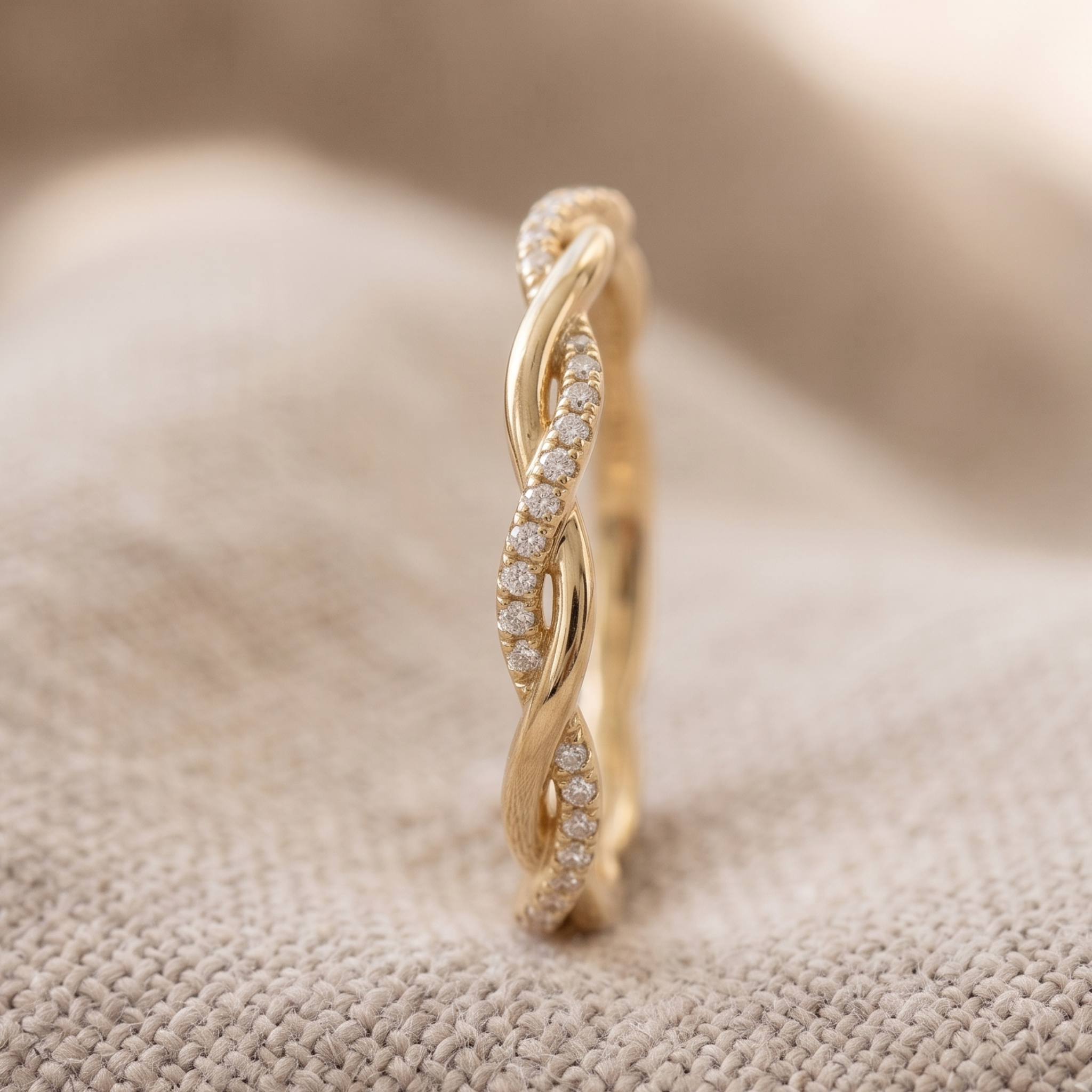 Round diamond wedding band with intertwined gold design
