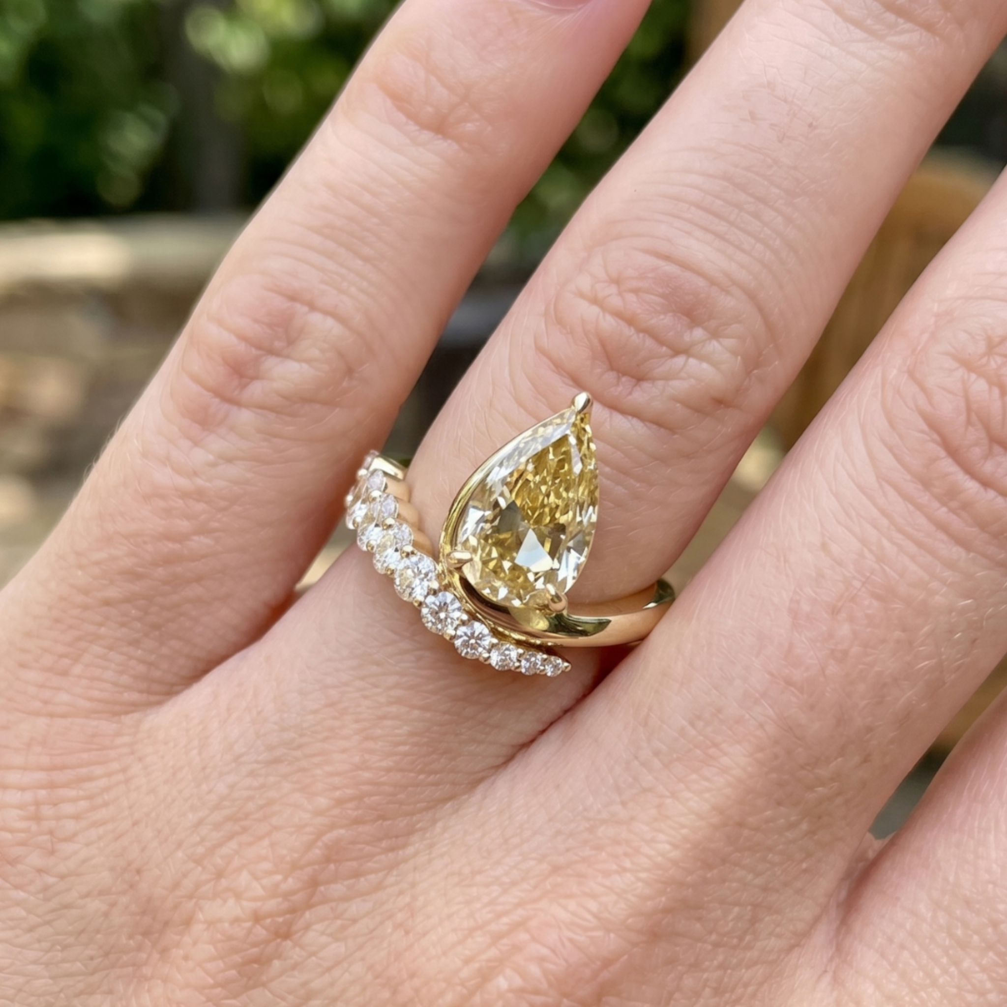 Aurelia 4.50 CTW pear diamond bypass ring by Kiashaa Jewellery featuring a 3 CT pear center diamond in polished yellow gold.