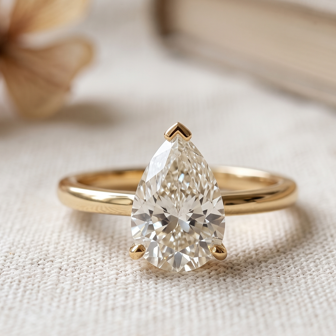 Kiashaa Jewellery 0.76 CT pear solitaire diamond ring in polished yellow gold.