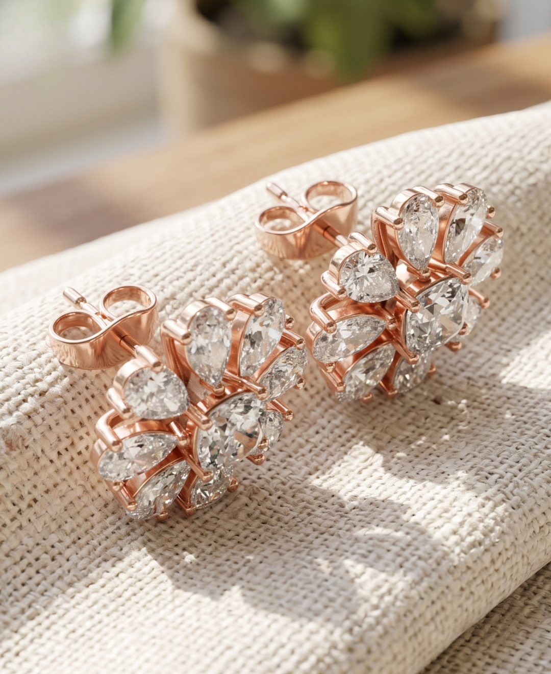 Kiashaa Jewellery cushion and pear lab-grown diamond flower earrings displayed as a matching rose gold pair.