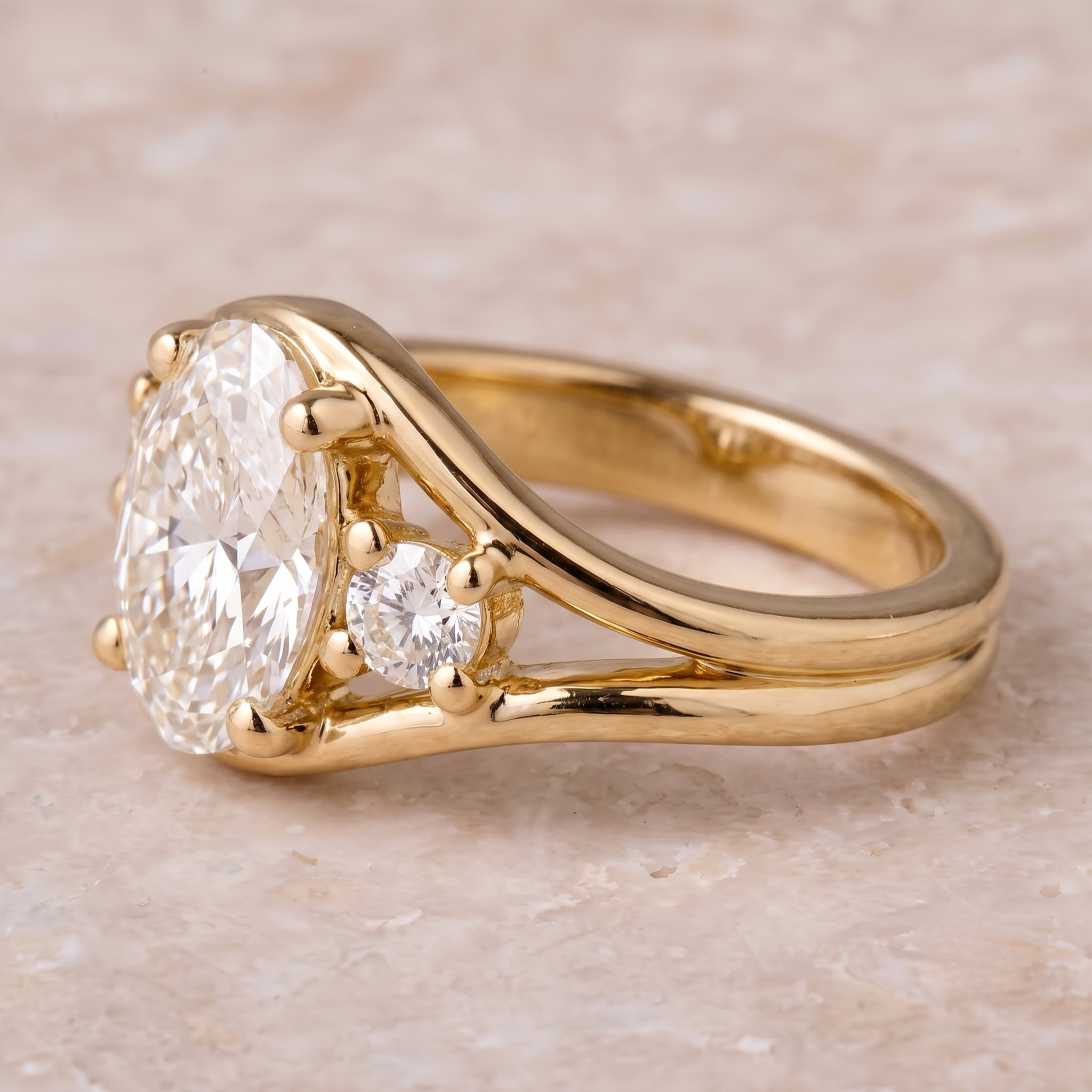 10 × 7 mm oval diamond engagement ring with split shank design