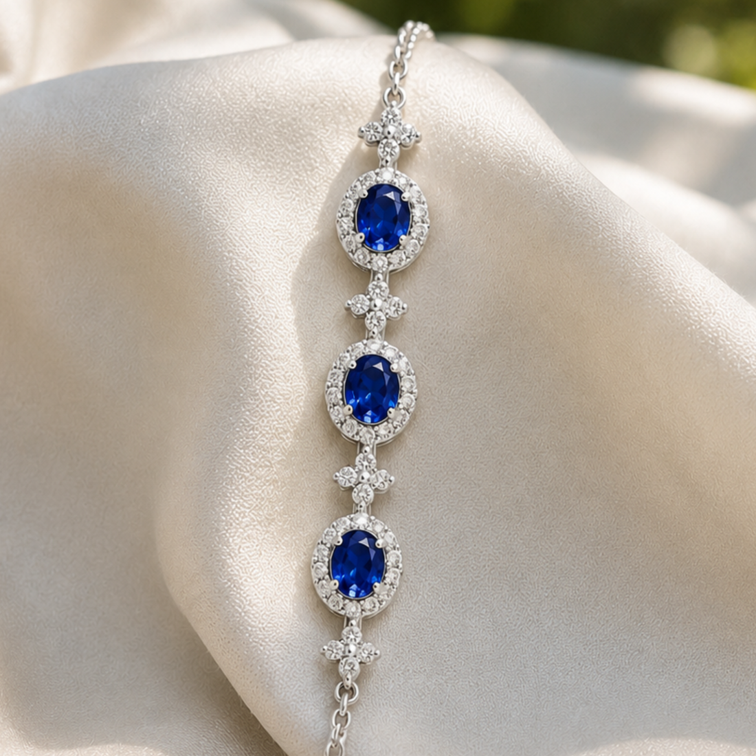 Royal blue oval gemstone bracelet with round lab-grown diamond halos by Kiashaa Jewellery.