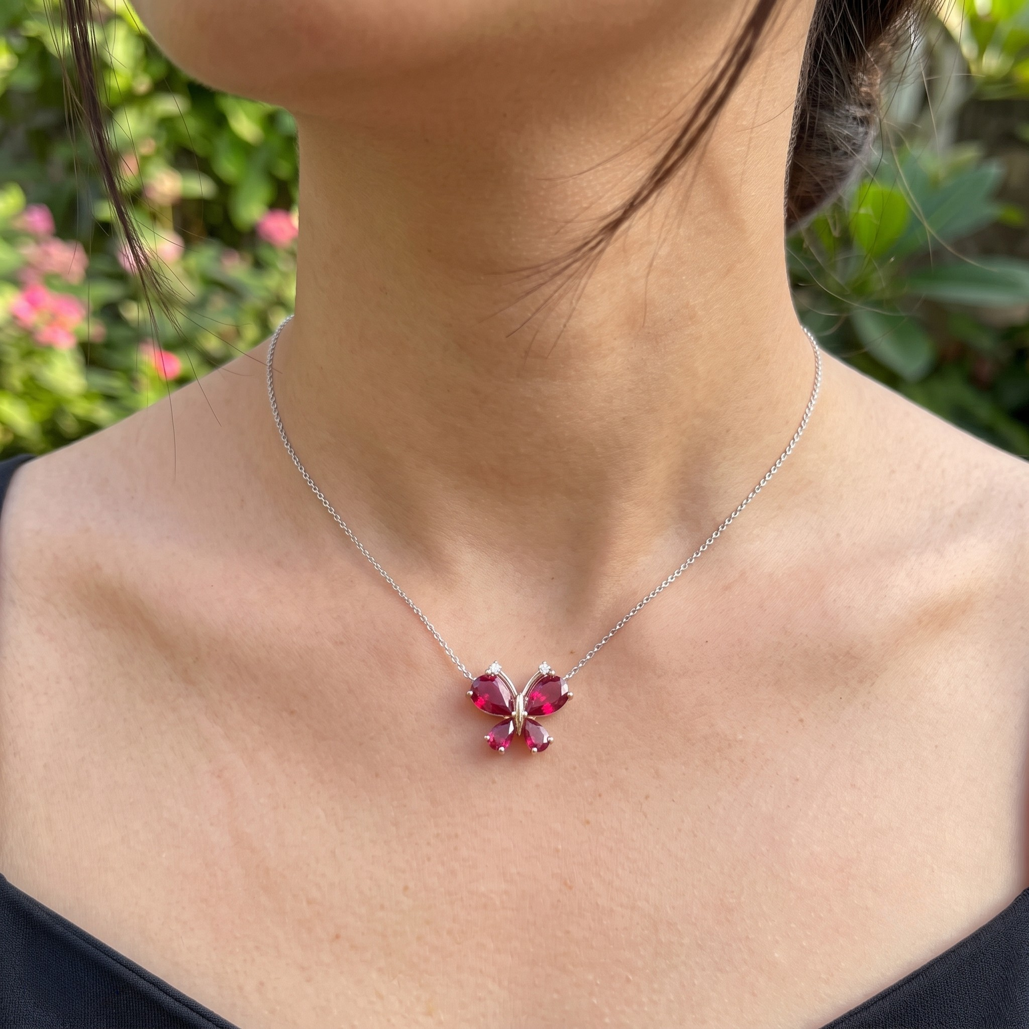 Red pear gemstone butterfly pendant necklace with lab-grown diamond accents by Kiashaa Jewellery.