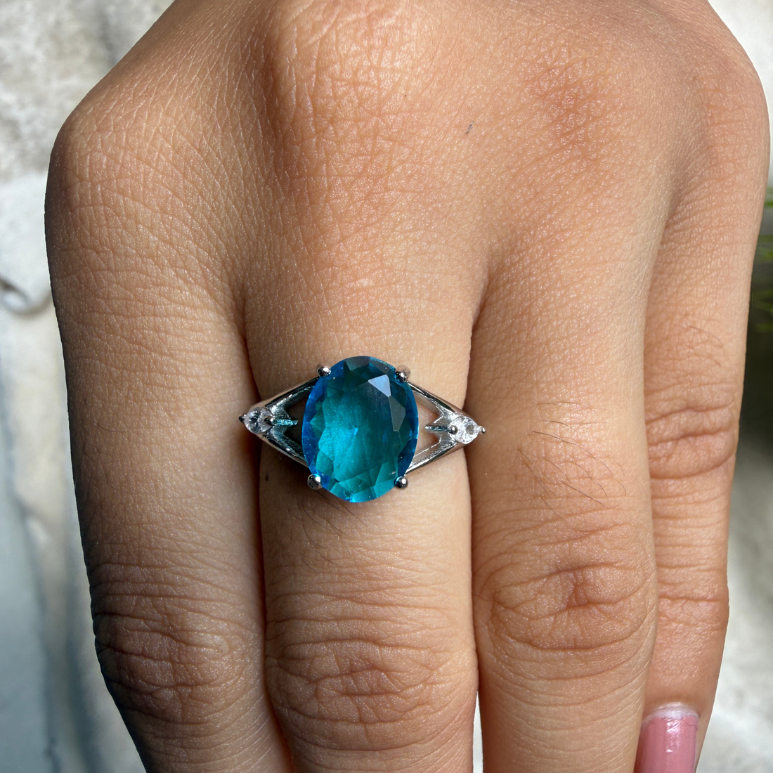 Blue oval gemstone solitaire ring with marquise lab-grown diamonds by Kiashaa Jewellery.