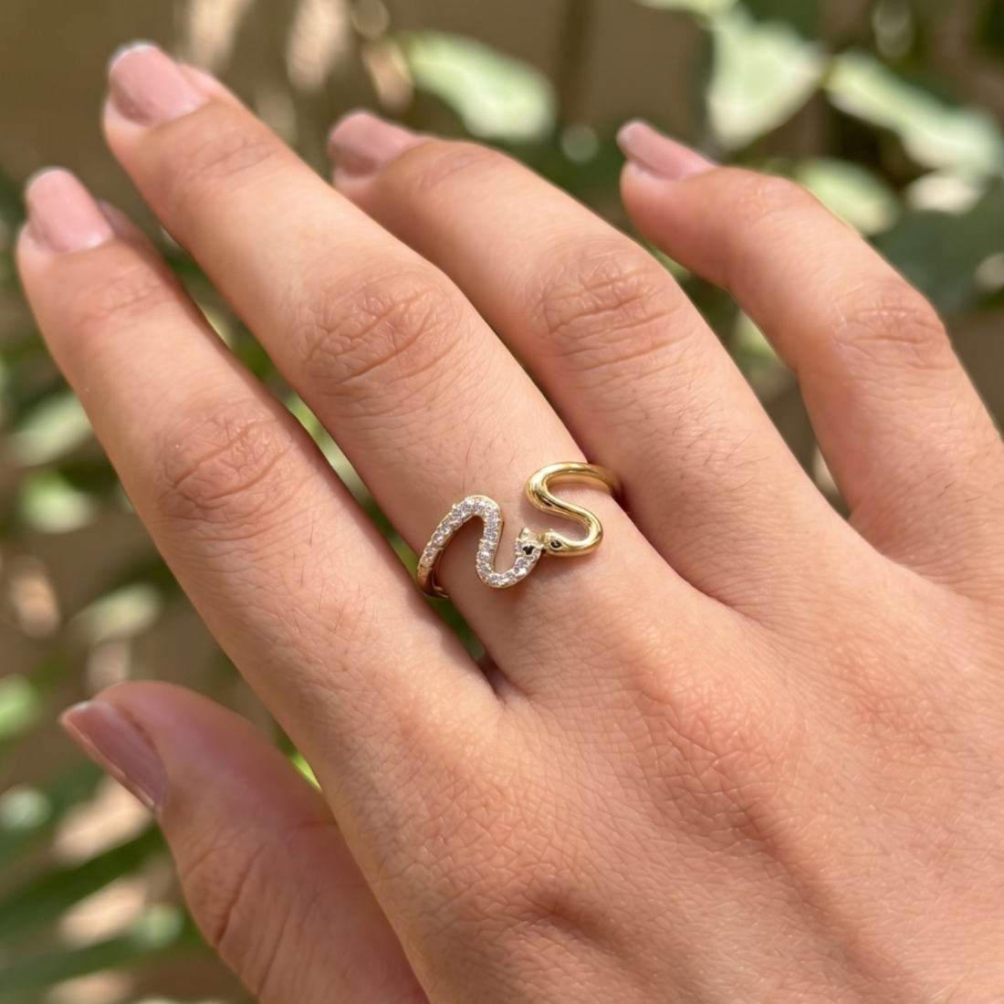 Romantic open ring featuring two swans forming a heart-shaped design.