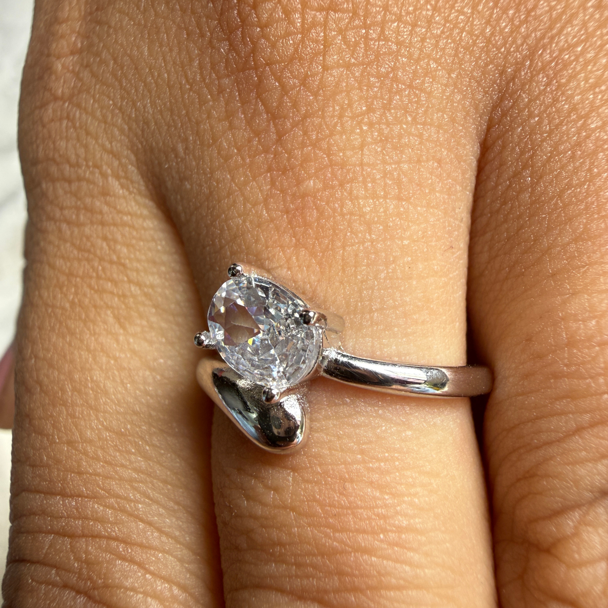 Oval lab-grown diamond bypass solitaire ring in white gold by Kiashaa Jewellery.