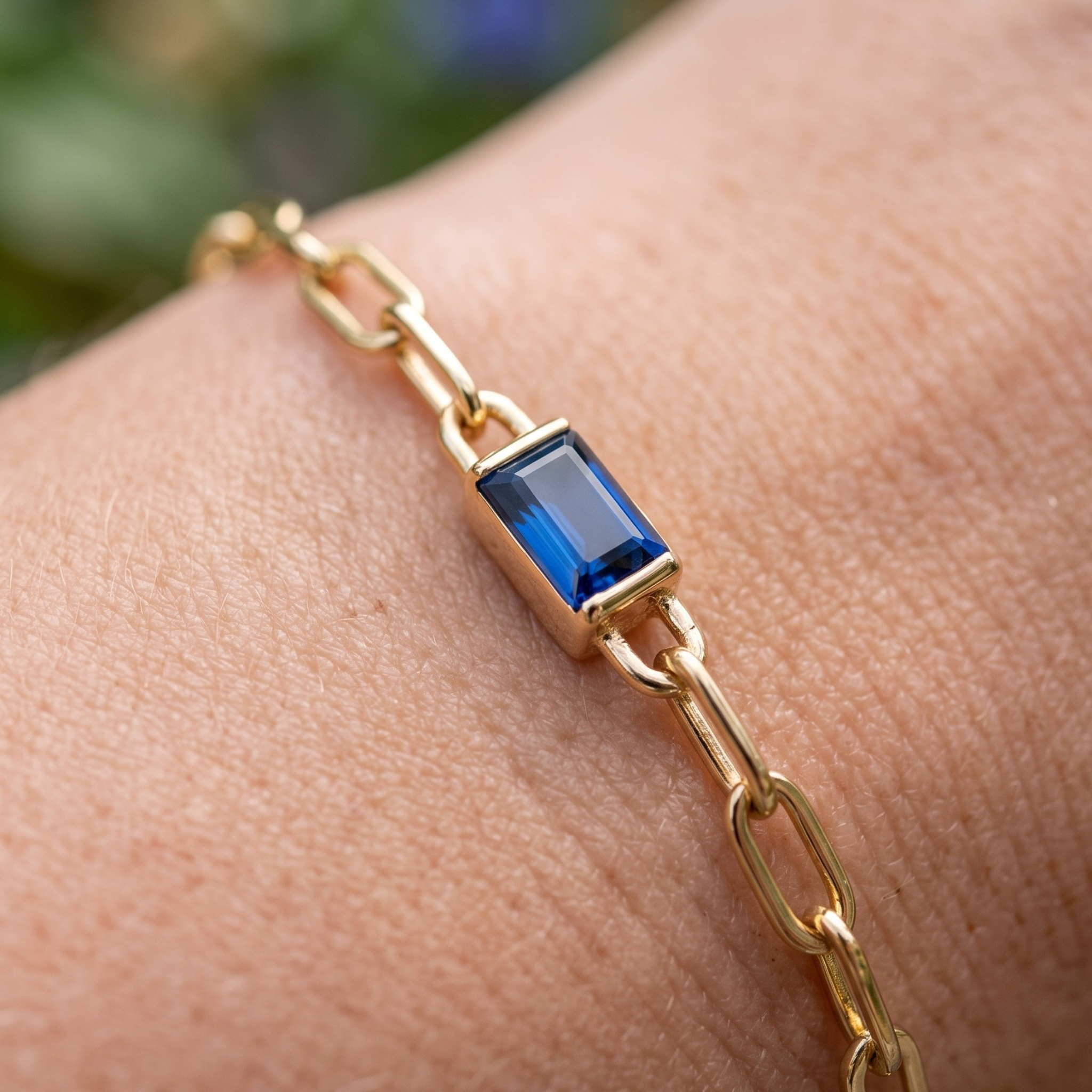 Kiashaa Jewellery 2.58 CT blue emerald-cut link bracelet in polished yellow gold.