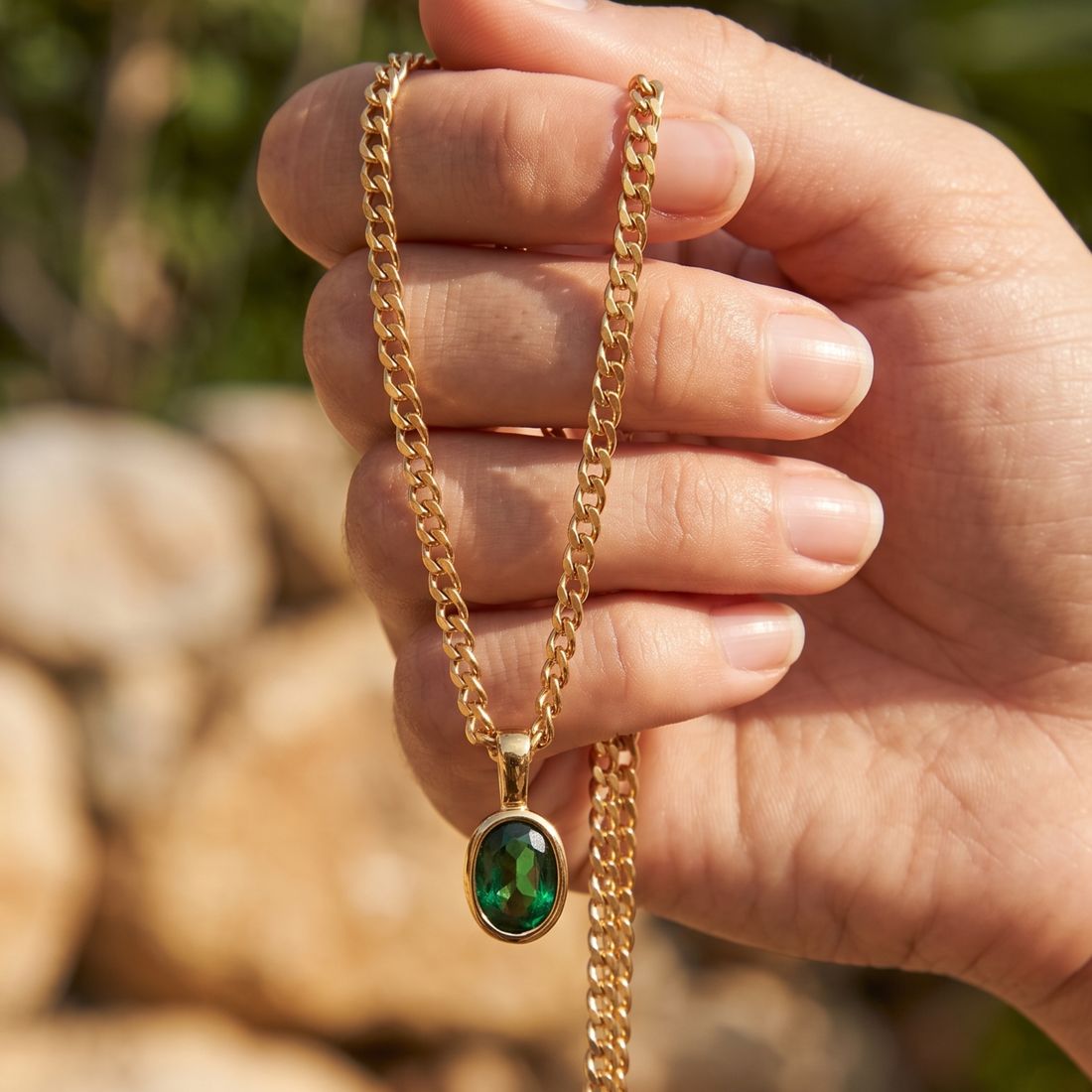 1.98 CT green oval gemstone pendant necklace with polished yellow gold Cuban chain.