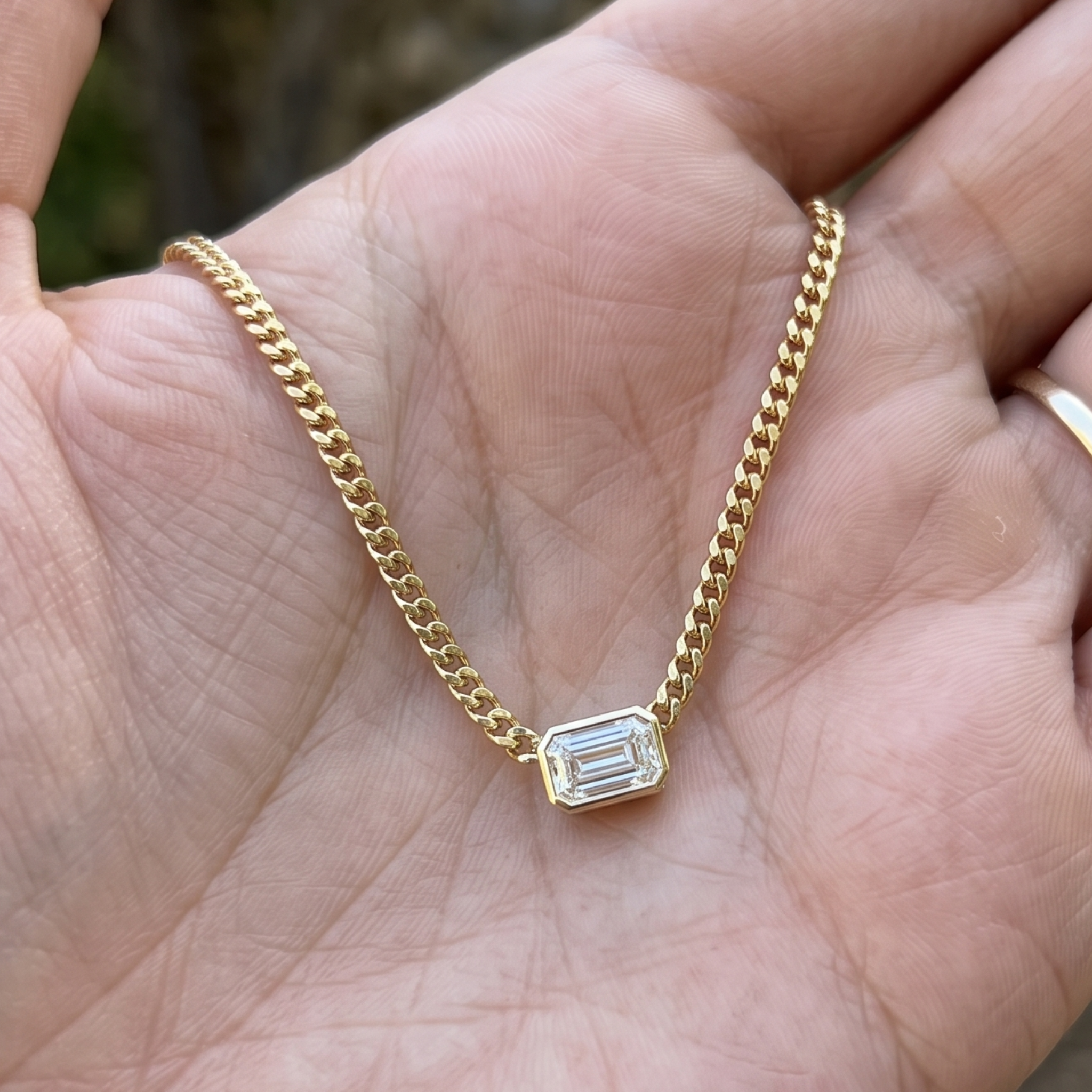Kiashaa Jewellery 1.73 CT emerald-cut diamond Cuban chain necklace in polished yellow gold.