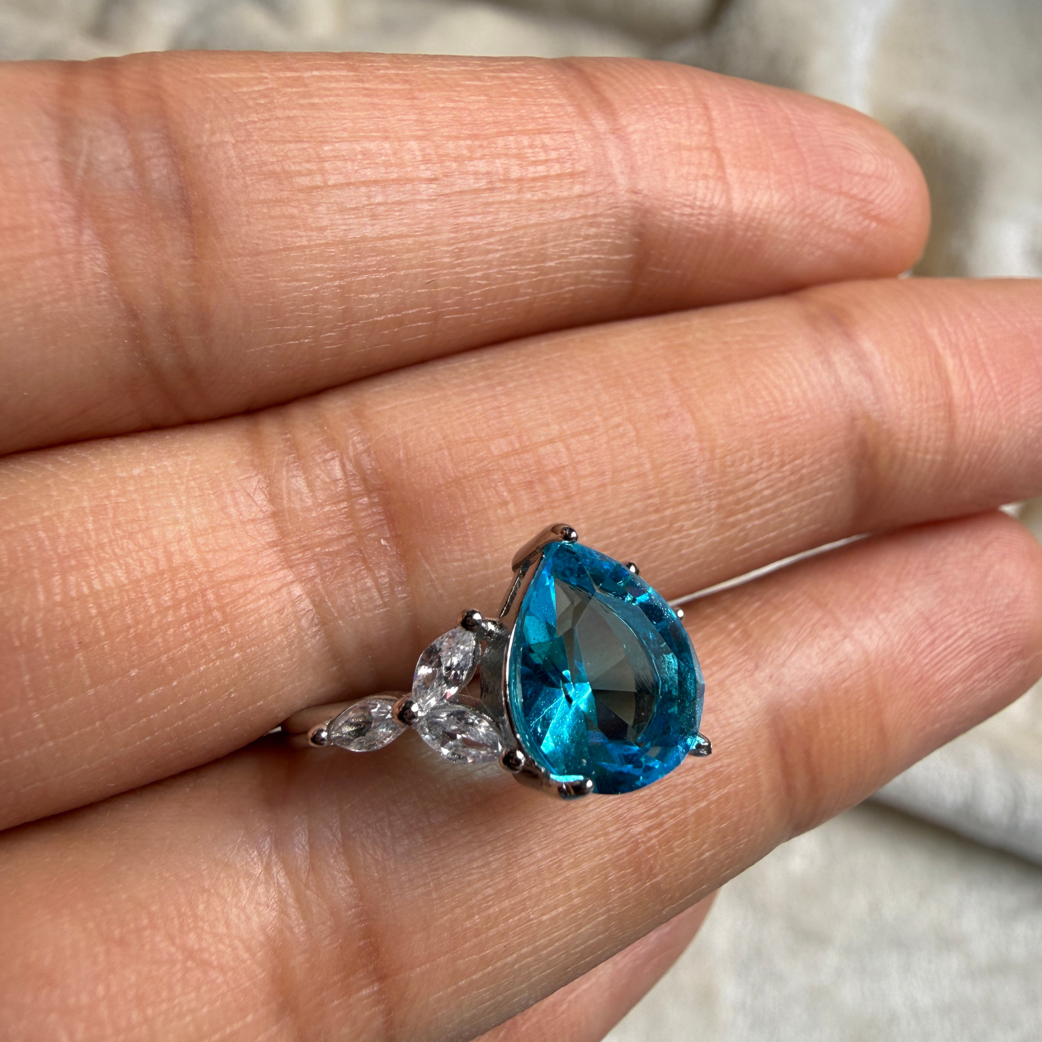 Blue pear gemstone and marquise lab-grown diamond ring by Kiashaa Jewellery.