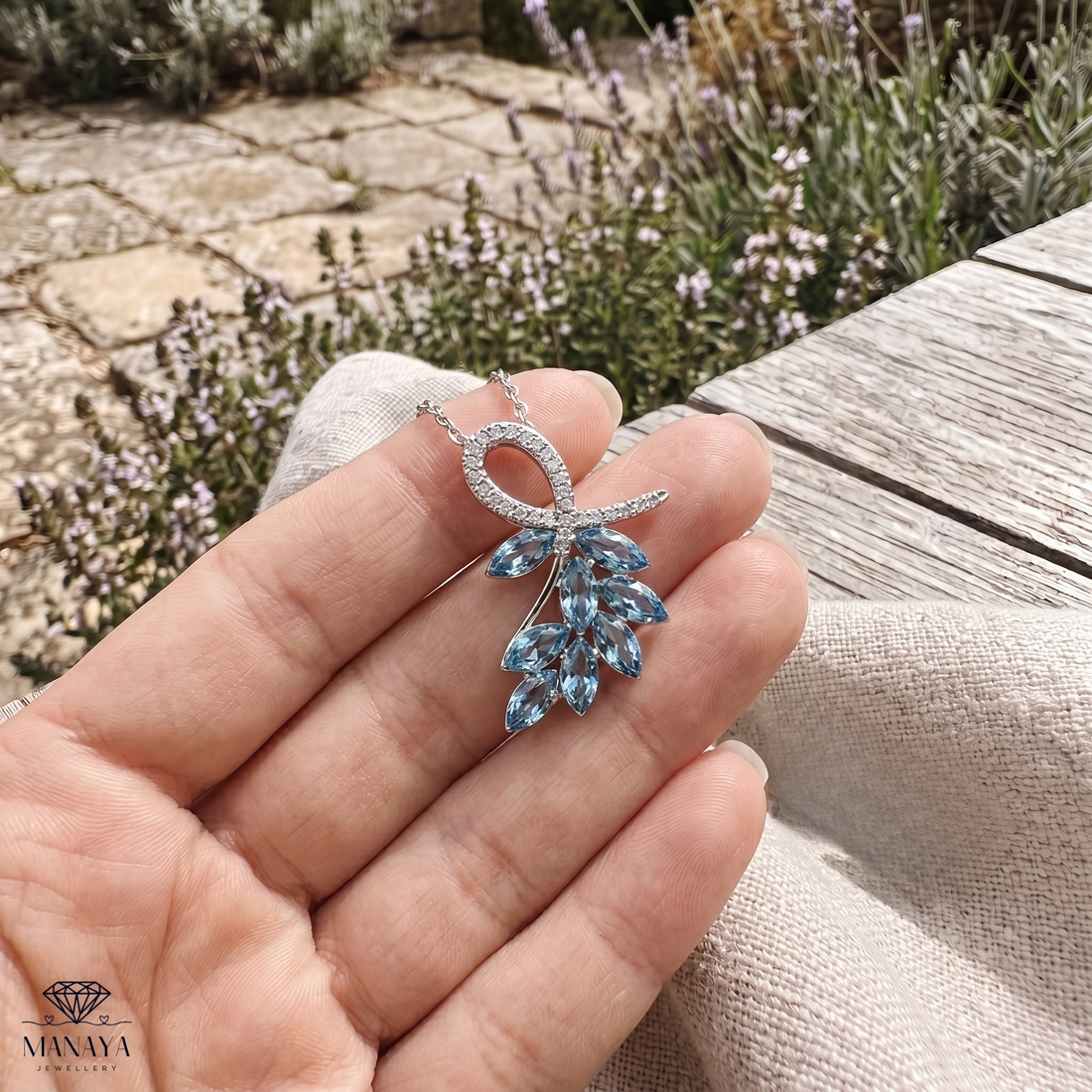 Sky blue marquise gemstone leaf pendant necklace with lab-grown diamonds by Kiashaa Jewellery.