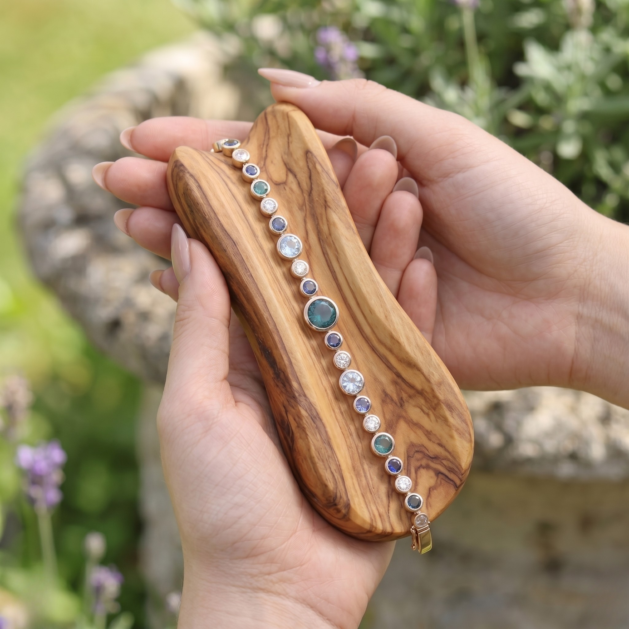 Rainbow bracelet featuring a continuous row of vibrant round gemstones.