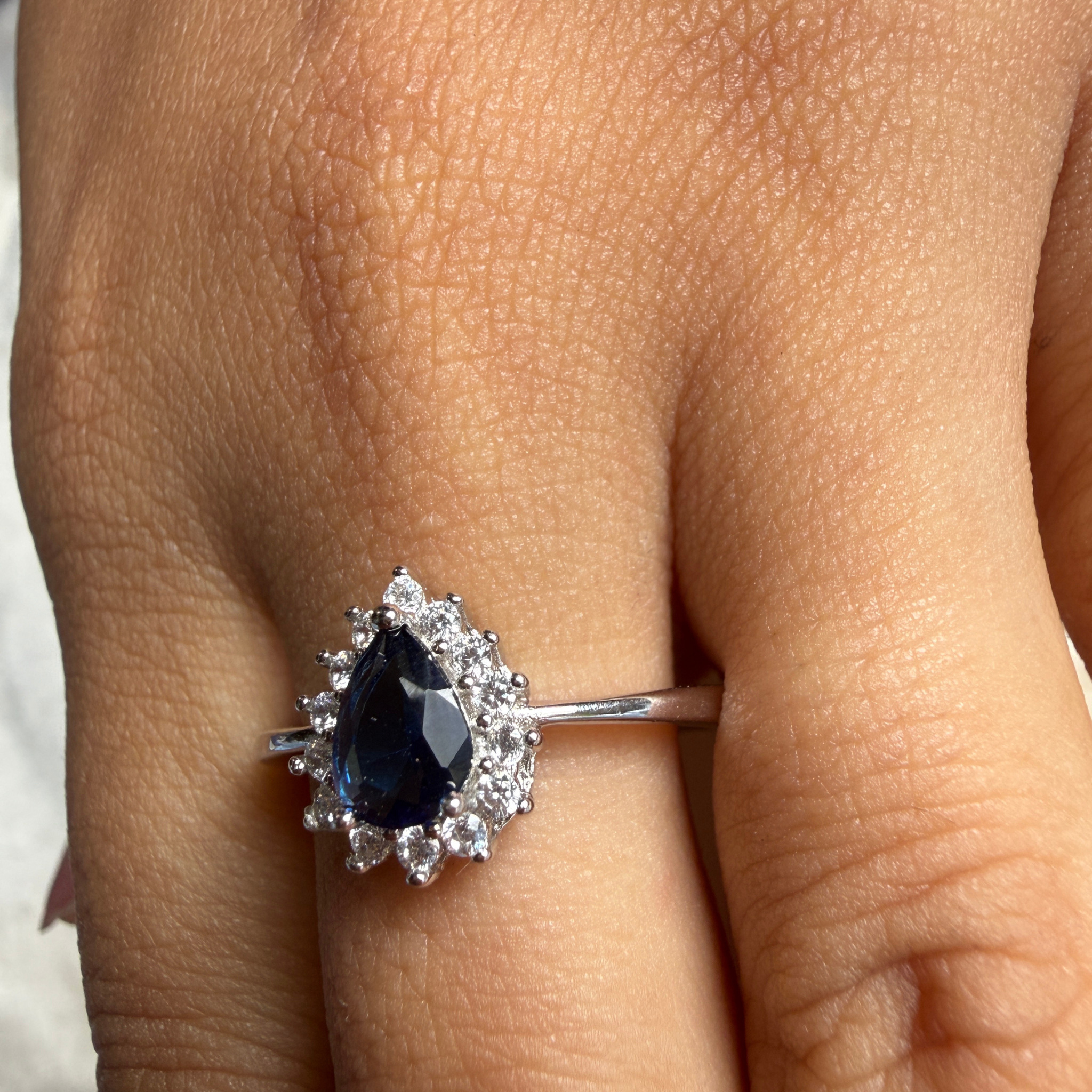 Blue pear gemstone and lab-grown diamond halo ring by Kiashaa Jewellery.