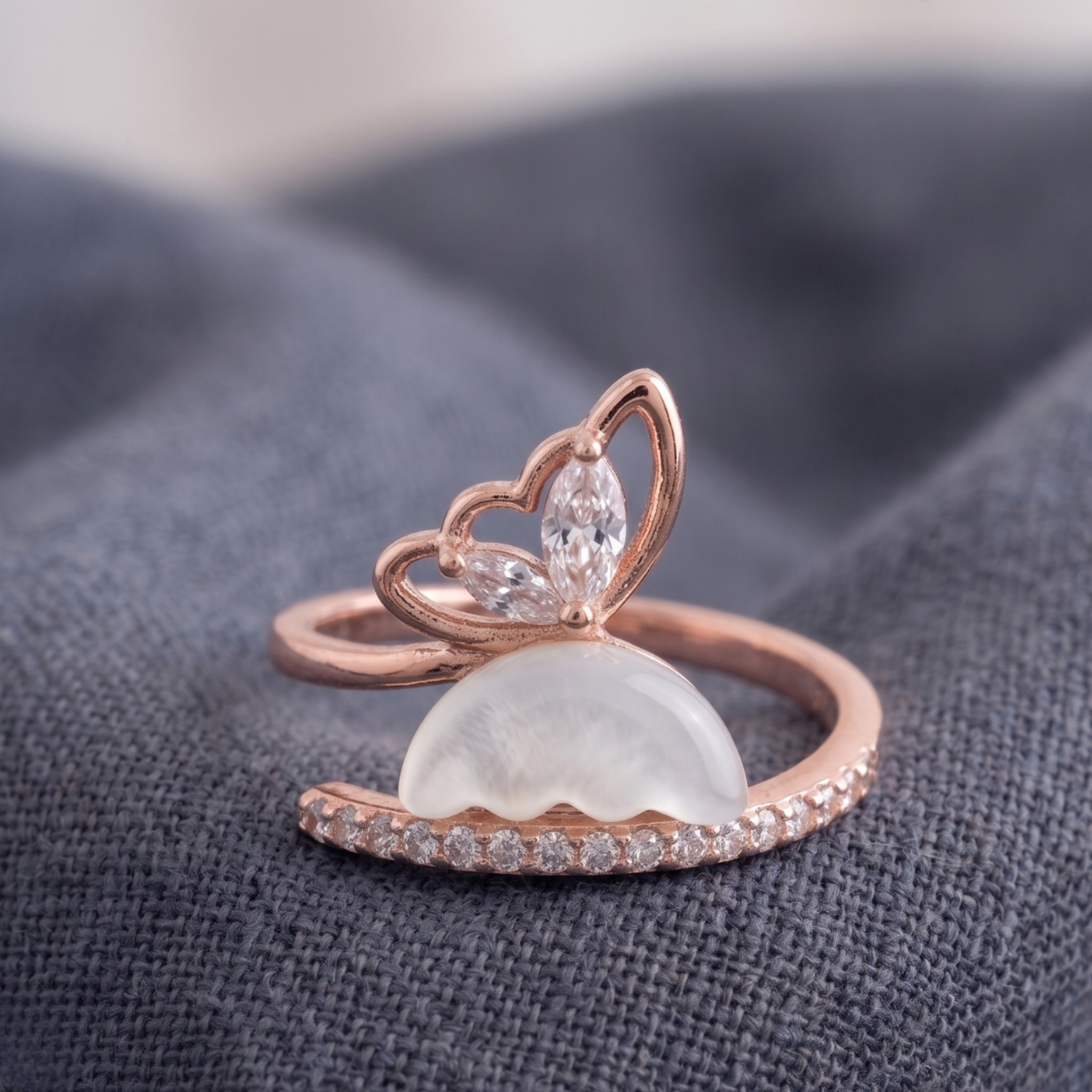 Nature-inspired open ring featuring marquise diamonds and a sculpted white pearl.