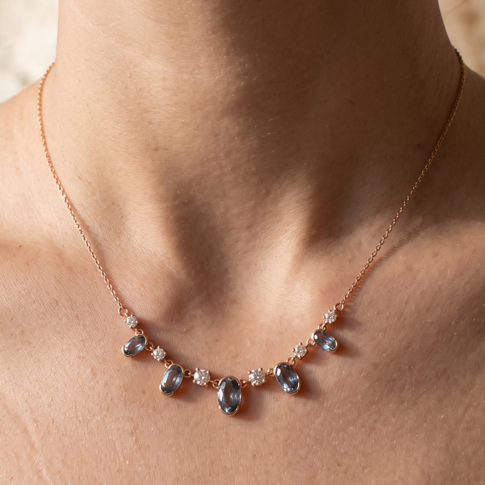 4.20 CTW oval and round diamond station necklace in polished yellow gold.